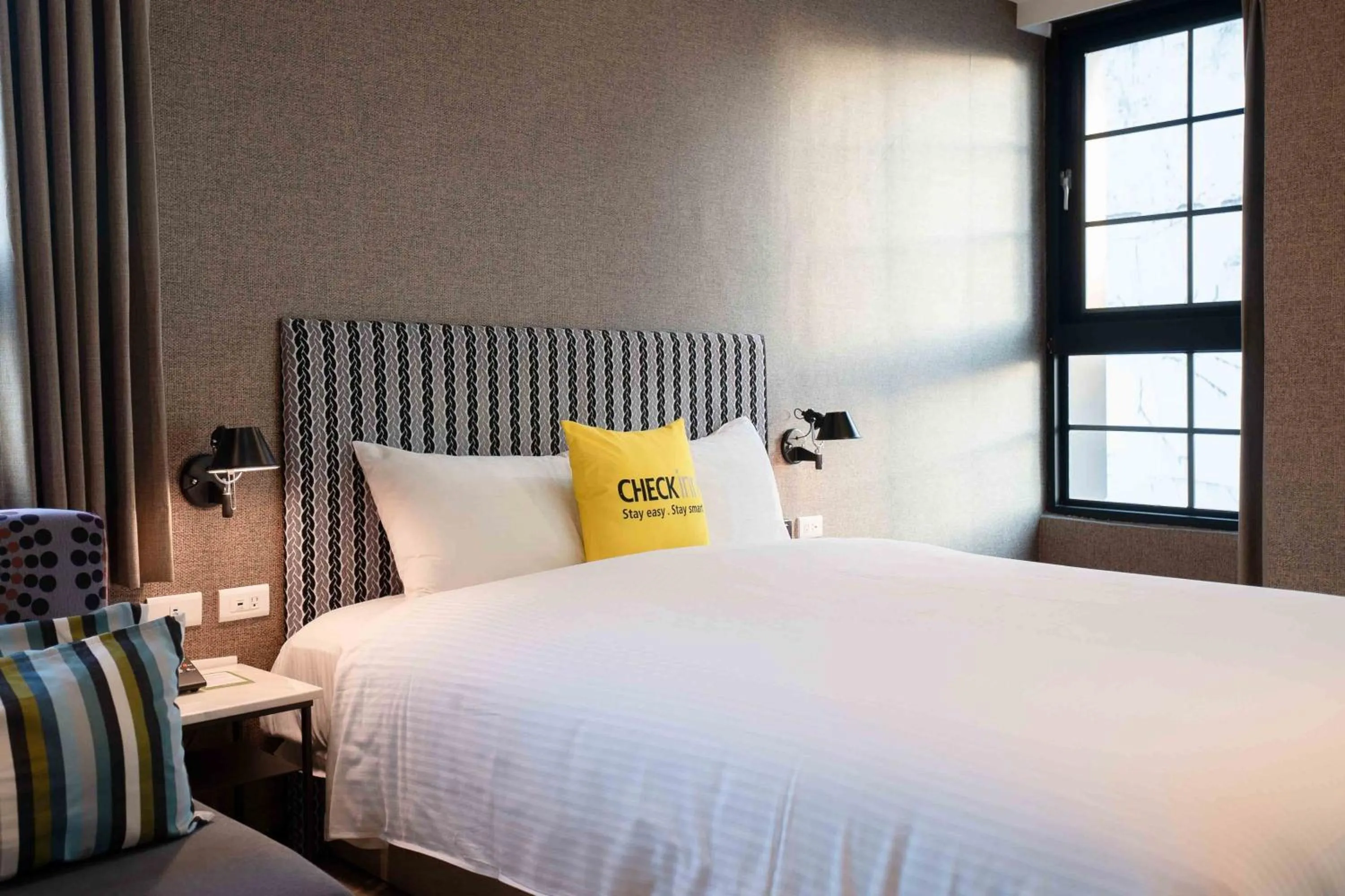 Bed in CHECK inn Taichung Ziyou