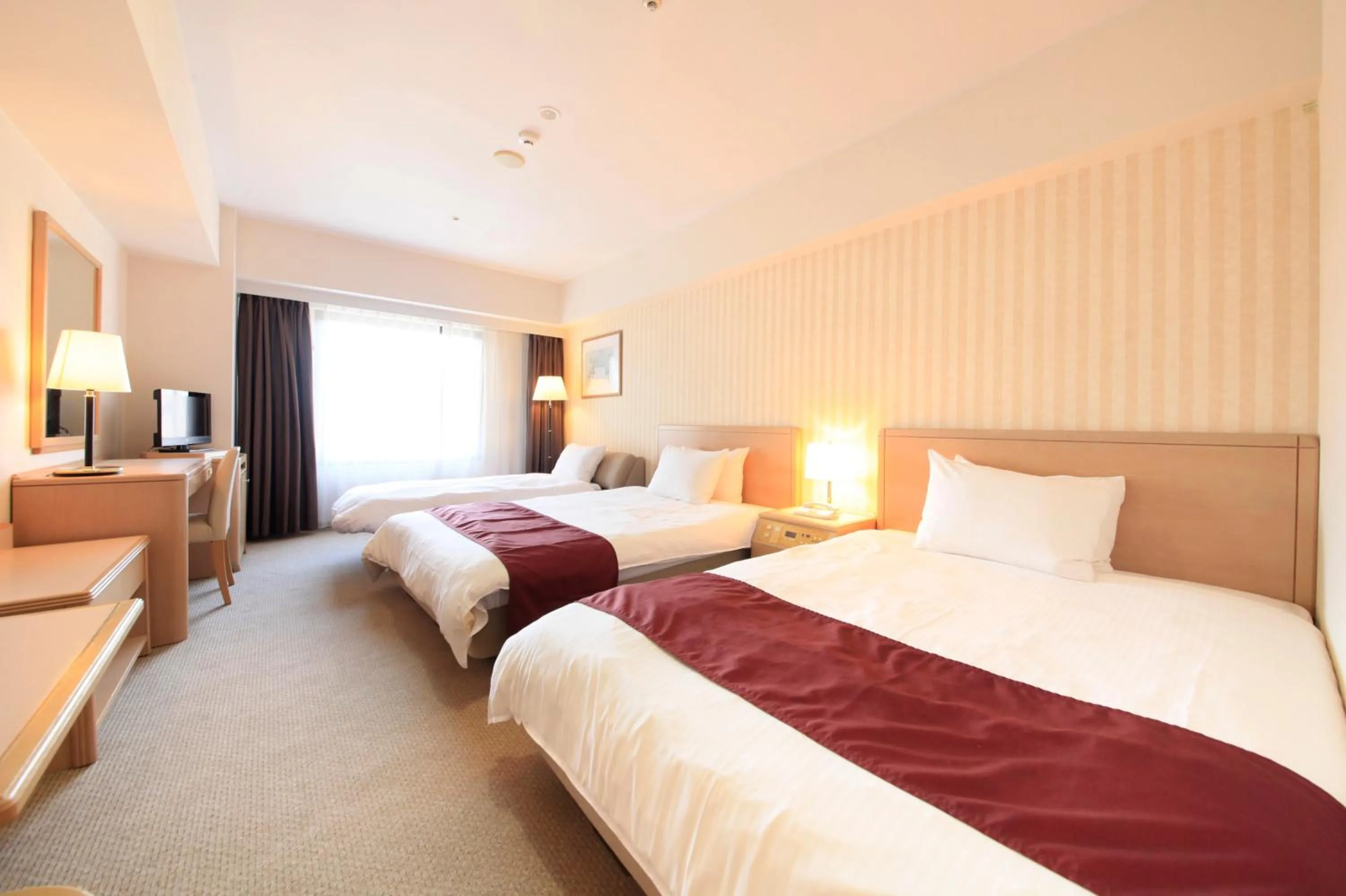 Photo of the whole room, Bed in Quintessa Hotel Sasebo