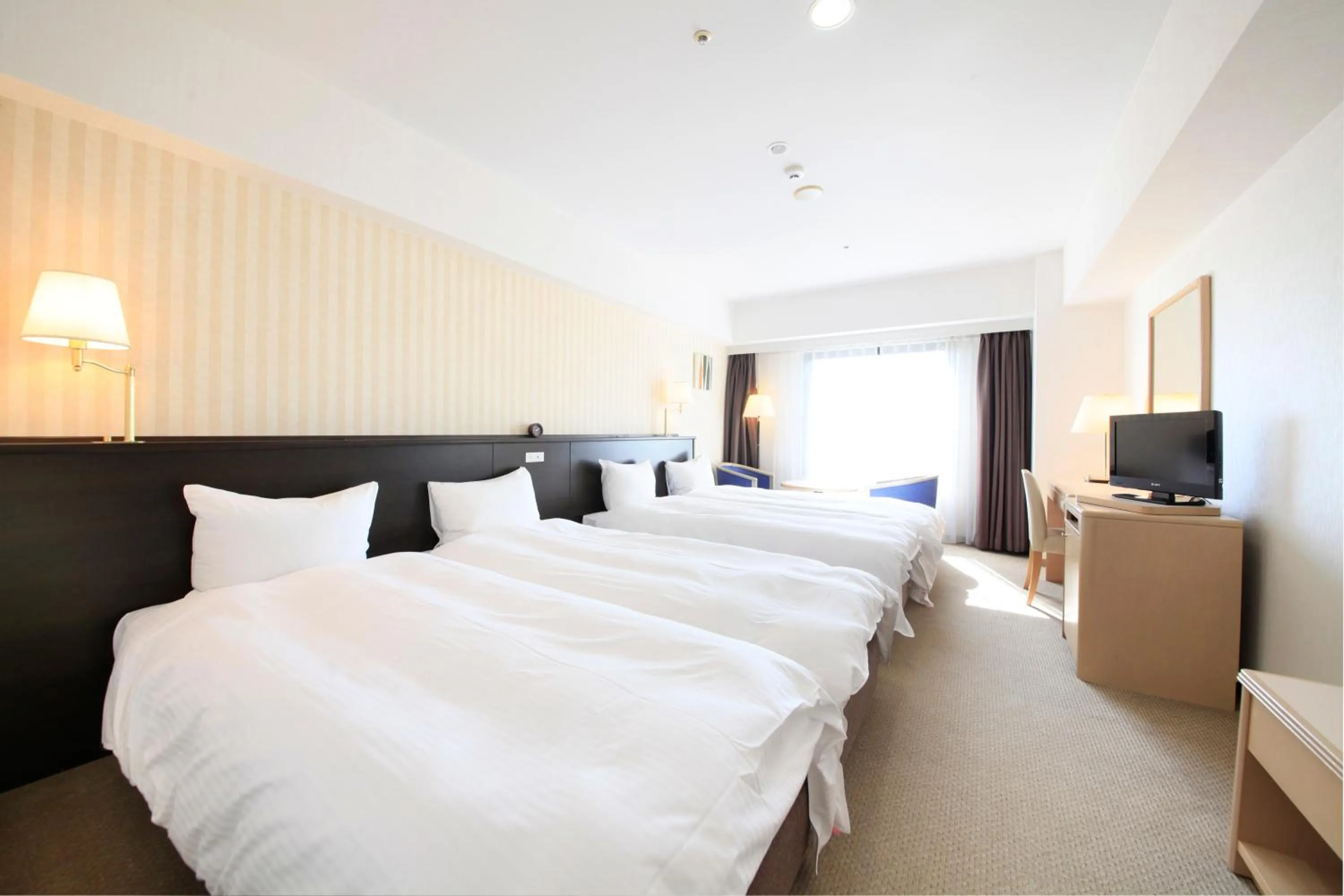 Photo of the whole room, Bed in Quintessa Hotel Sasebo