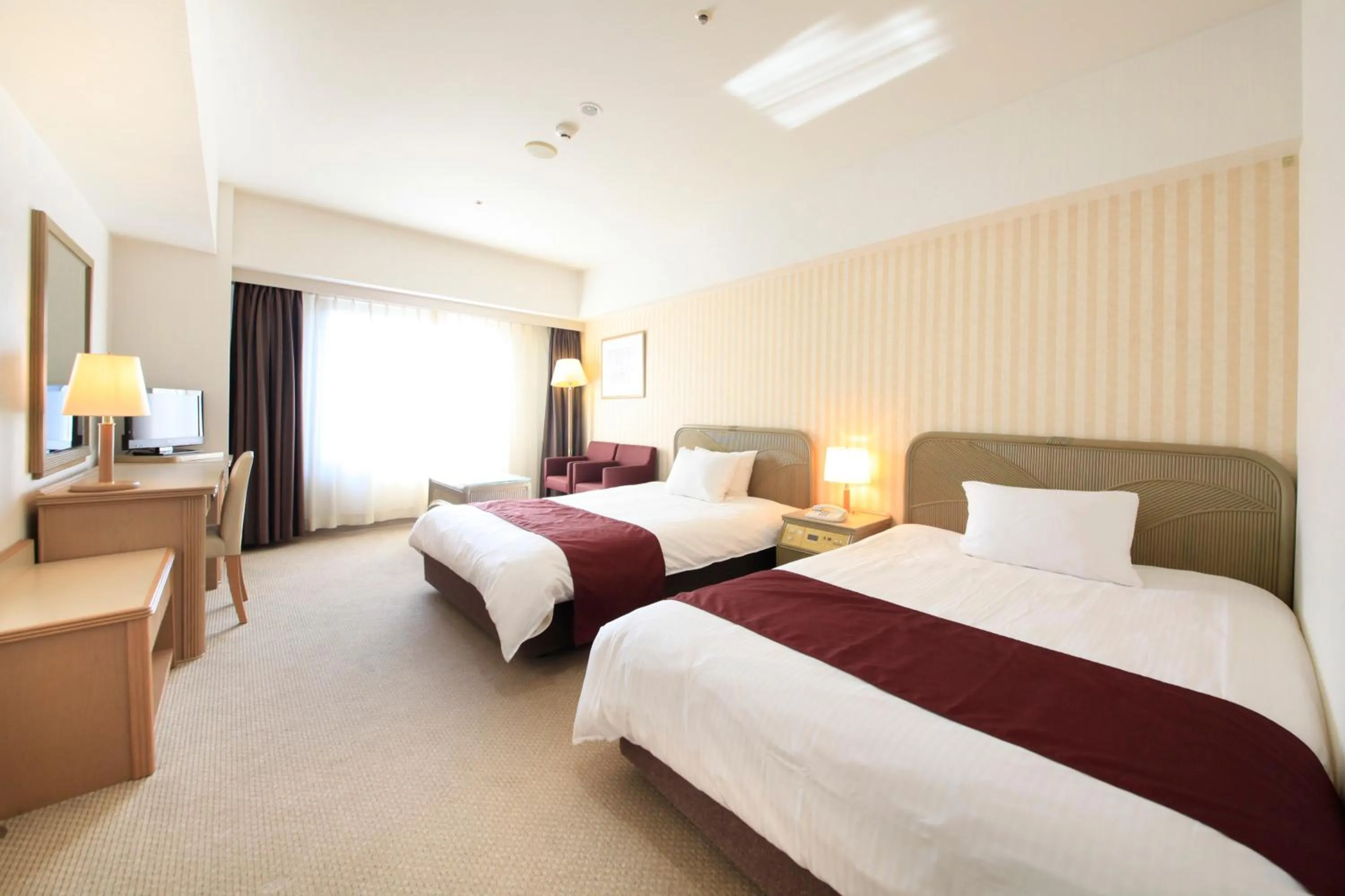 Photo of the whole room, Bed in Quintessa Hotel Sasebo