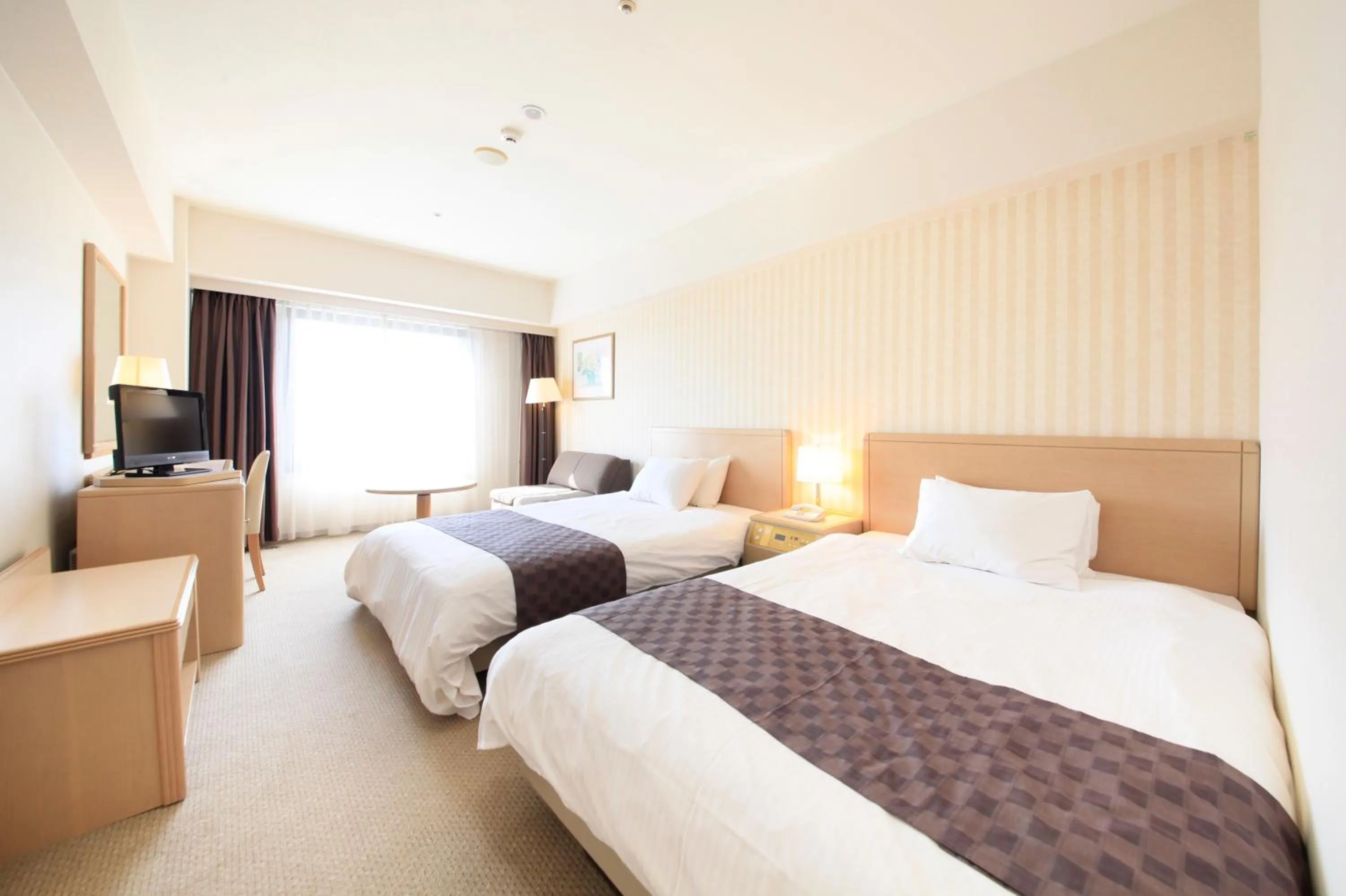 Photo of the whole room, Bed in Quintessa Hotel Sasebo