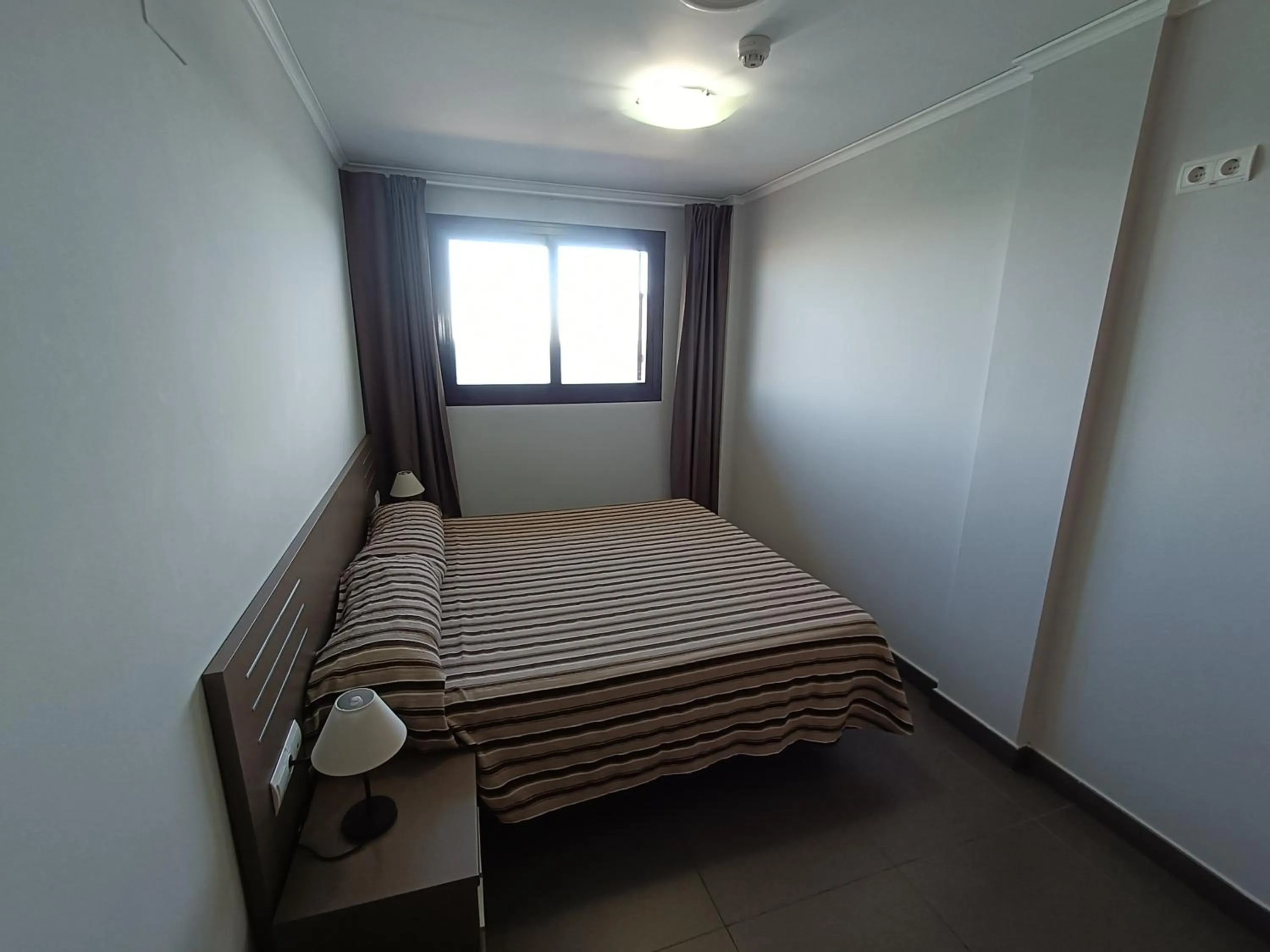 Bed in Aparthotel El Faro