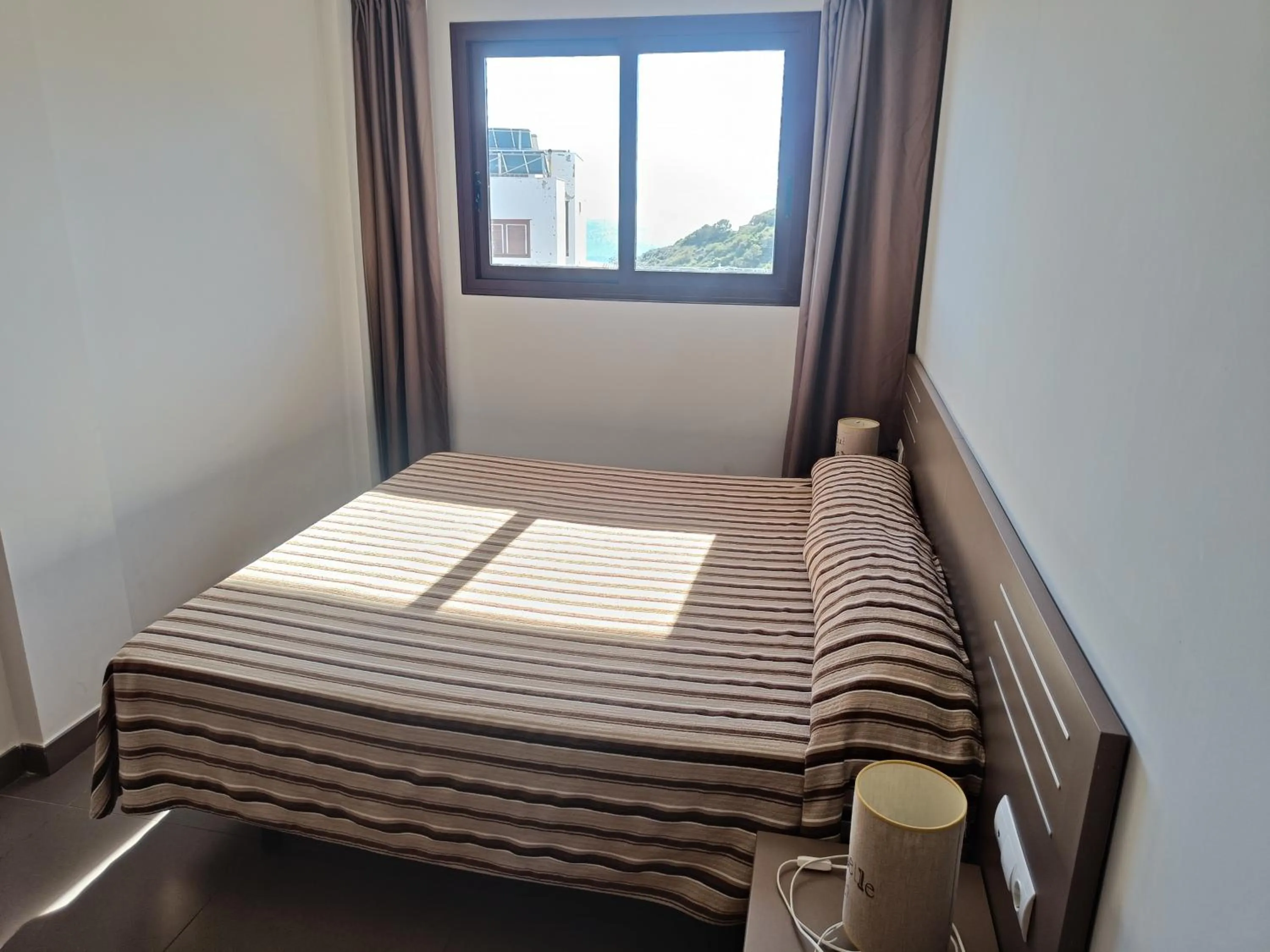 Bed in Aparthotel El Faro