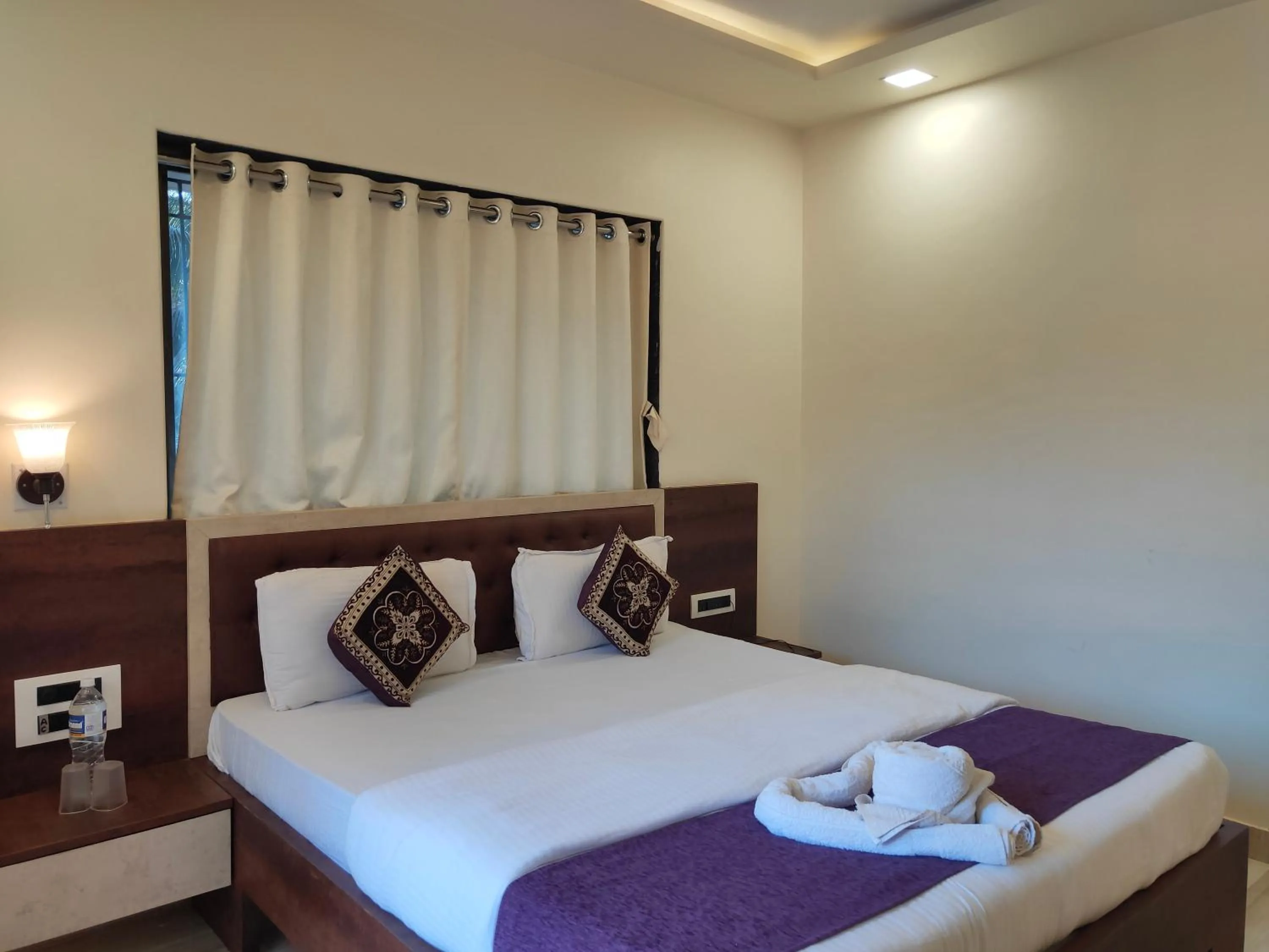 Bed in Hotel Grand Ganesha