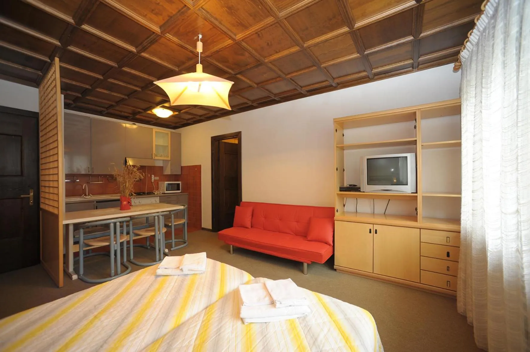 Photo of the whole room, Bed in Residence Regina Delle Dolomiti