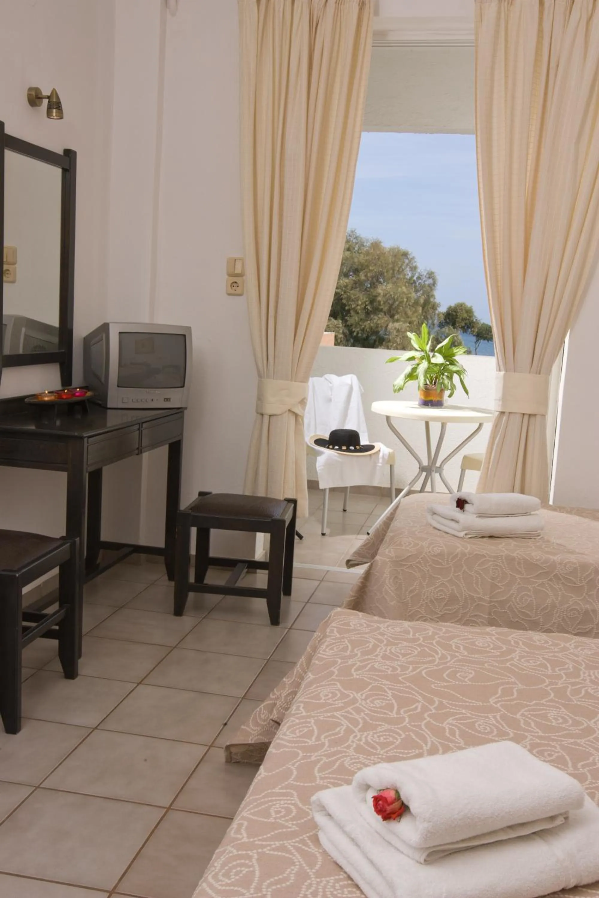 Bed in Akti Corali Hotel