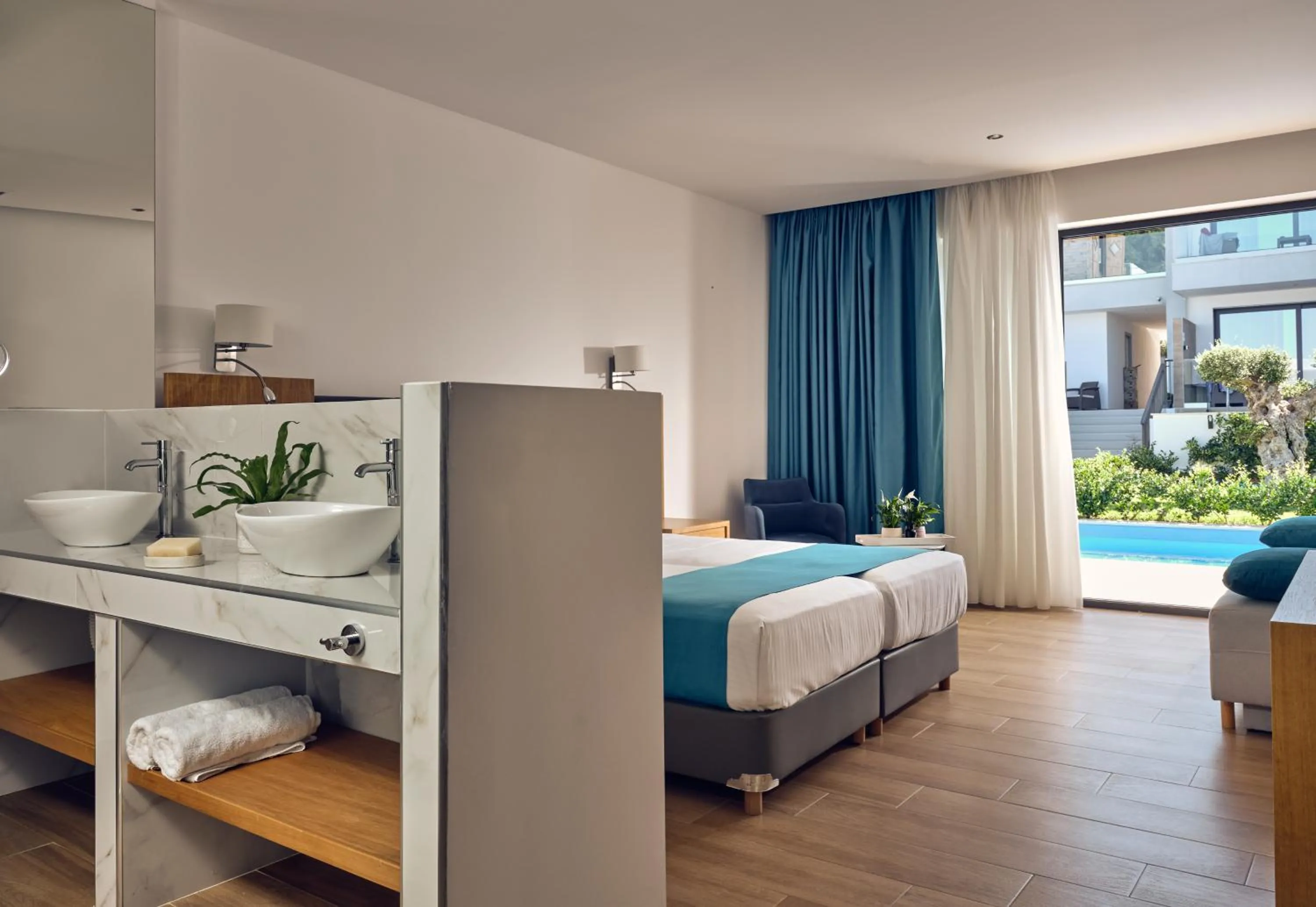 Photo of the whole room, Bed in Cavo Orient Beach Hotel & Suites