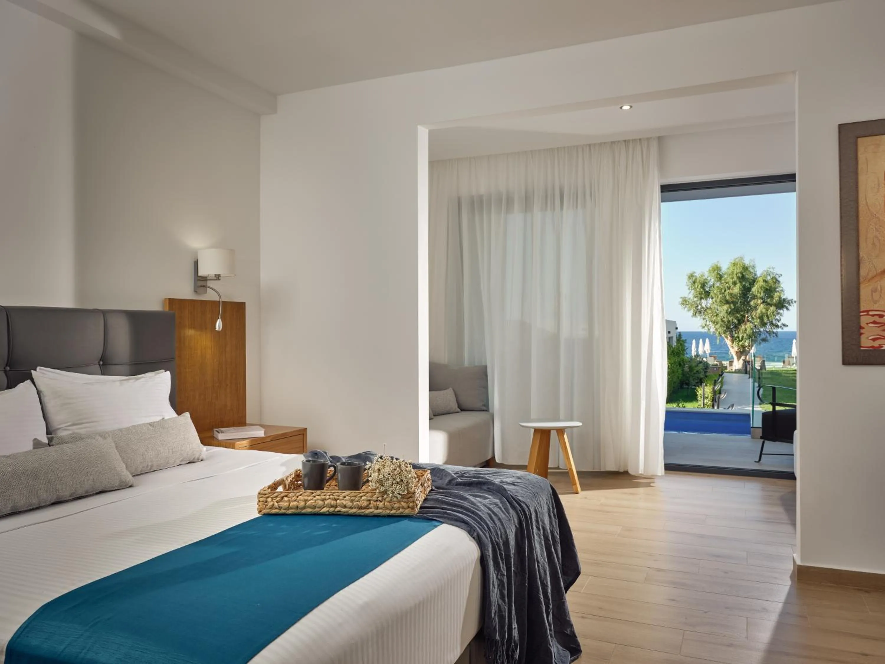 Bedroom, Bed in Cavo Orient Beach Hotel & Suites