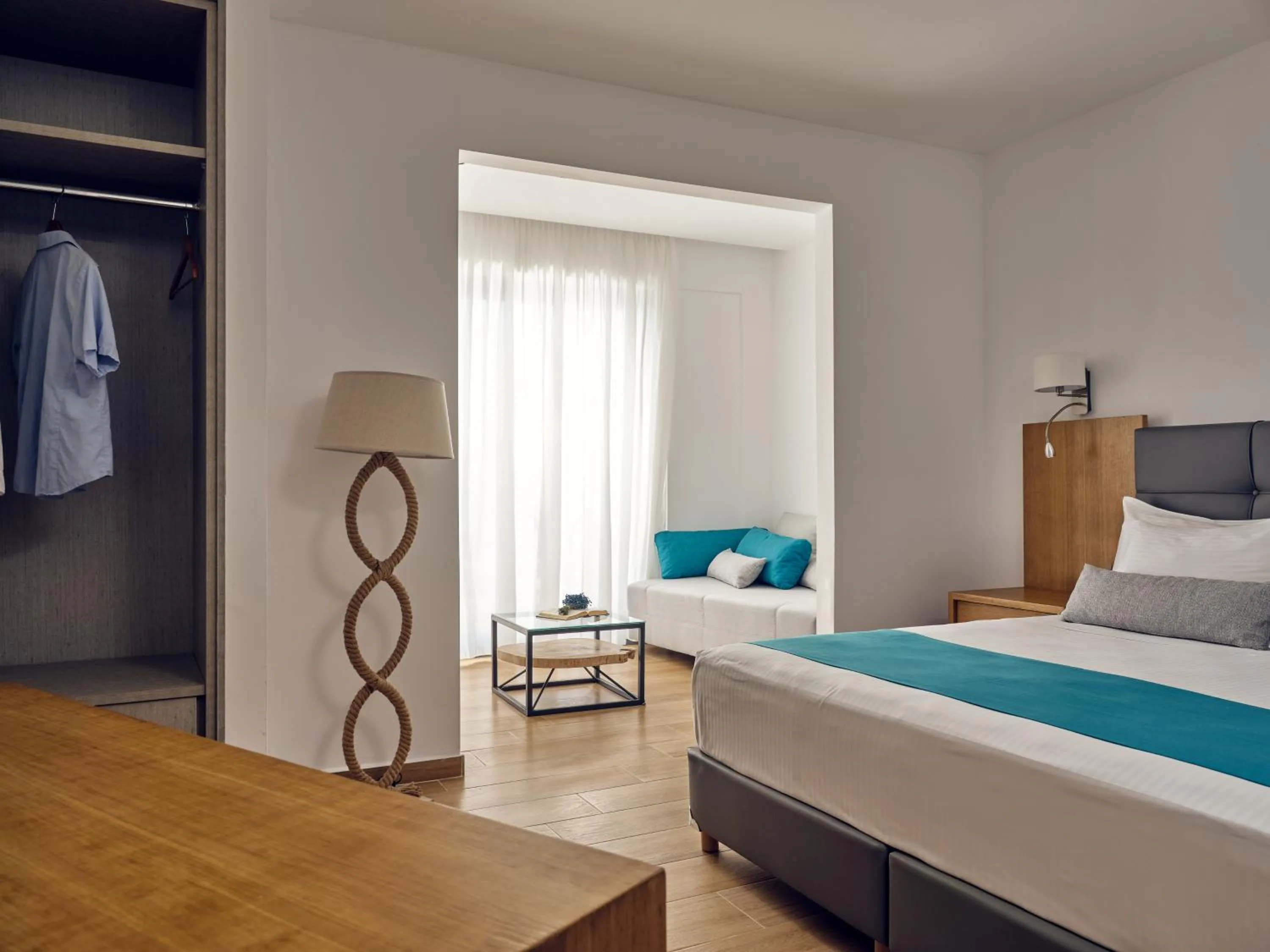 Photo of the whole room, Bed in Cavo Orient Beach Hotel & Suites