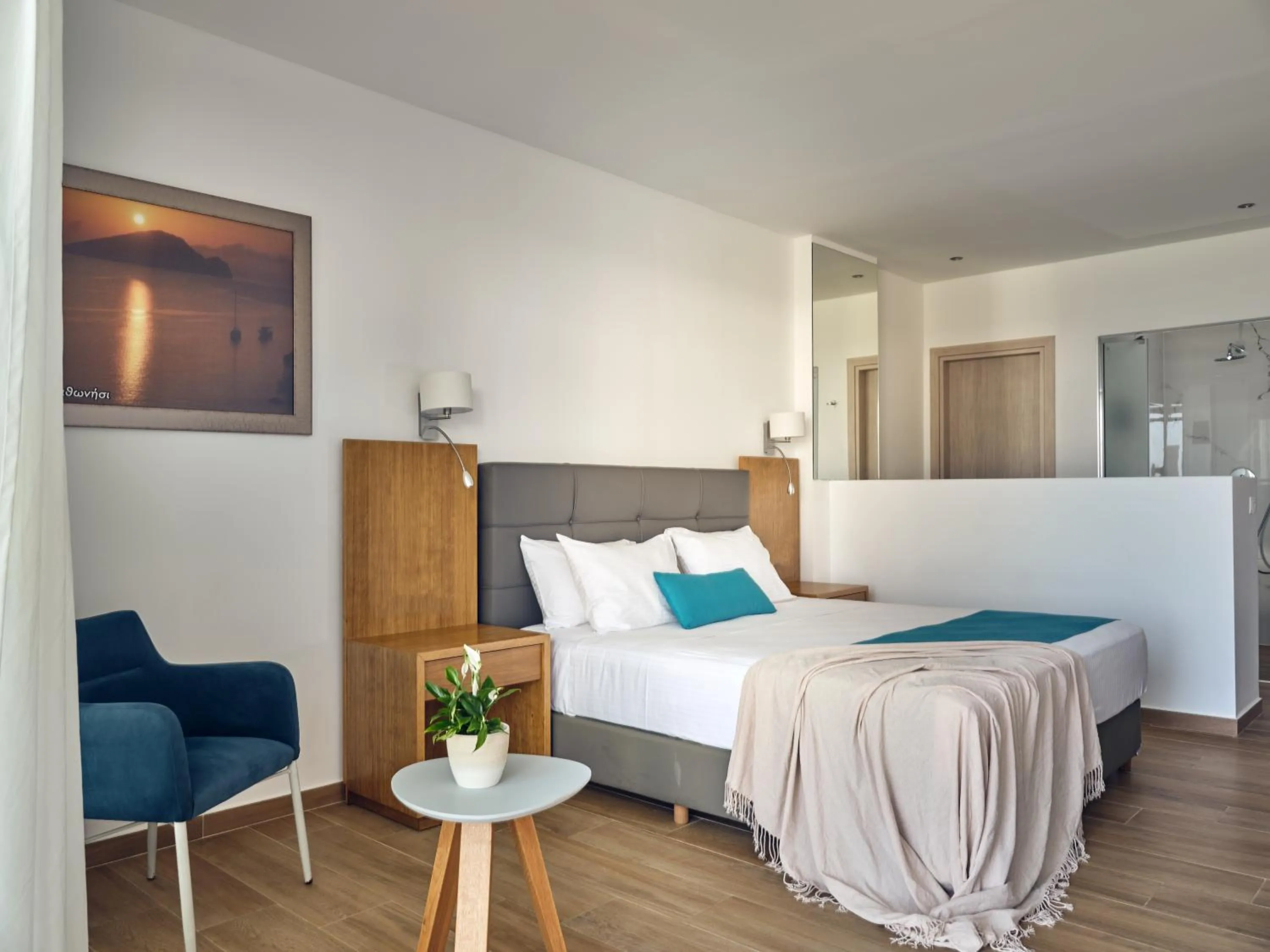 Photo of the whole room, Bed in Cavo Orient Beach Hotel & Suites