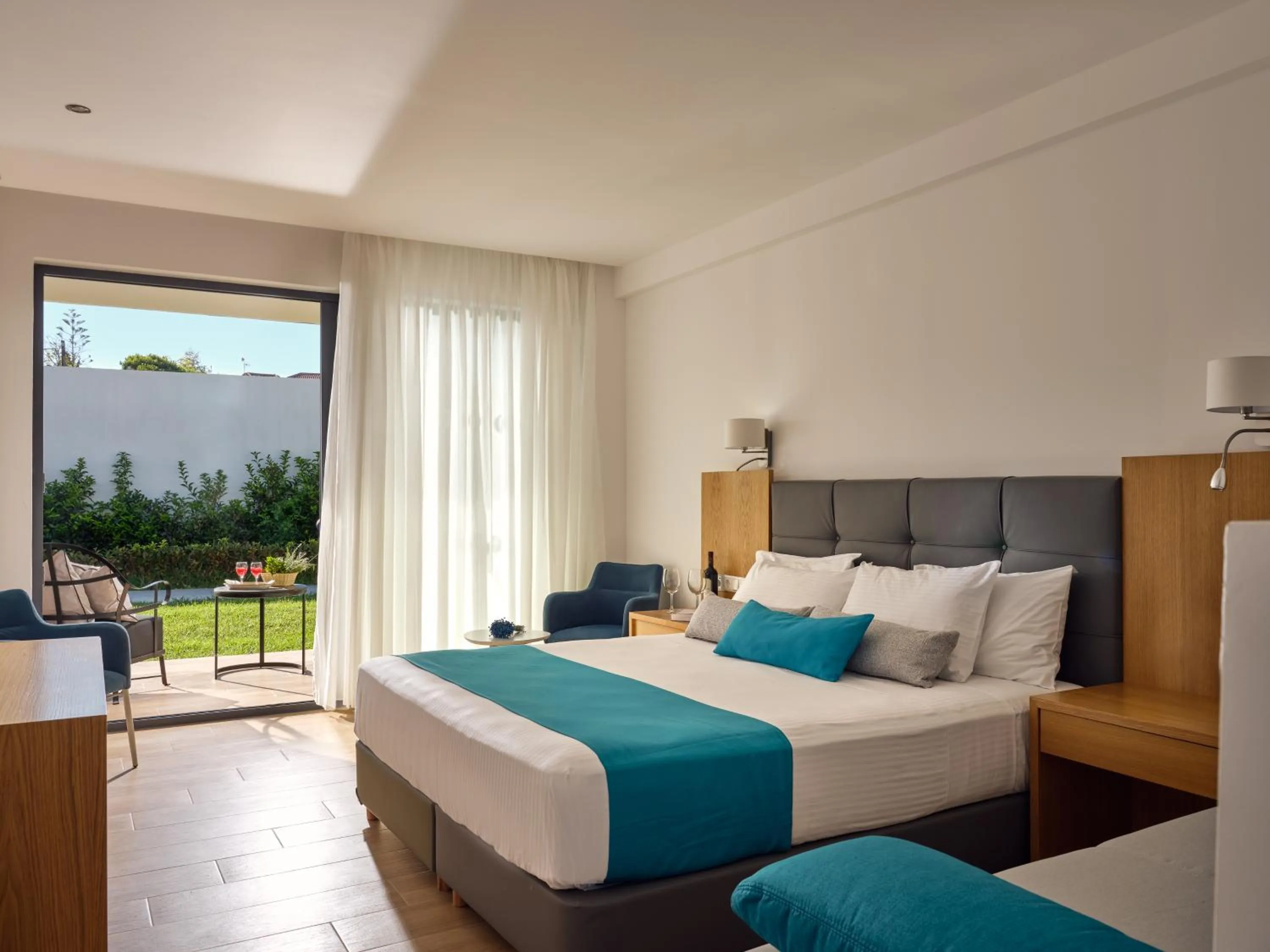Bedroom, Bed in Cavo Orient Beach Hotel & Suites