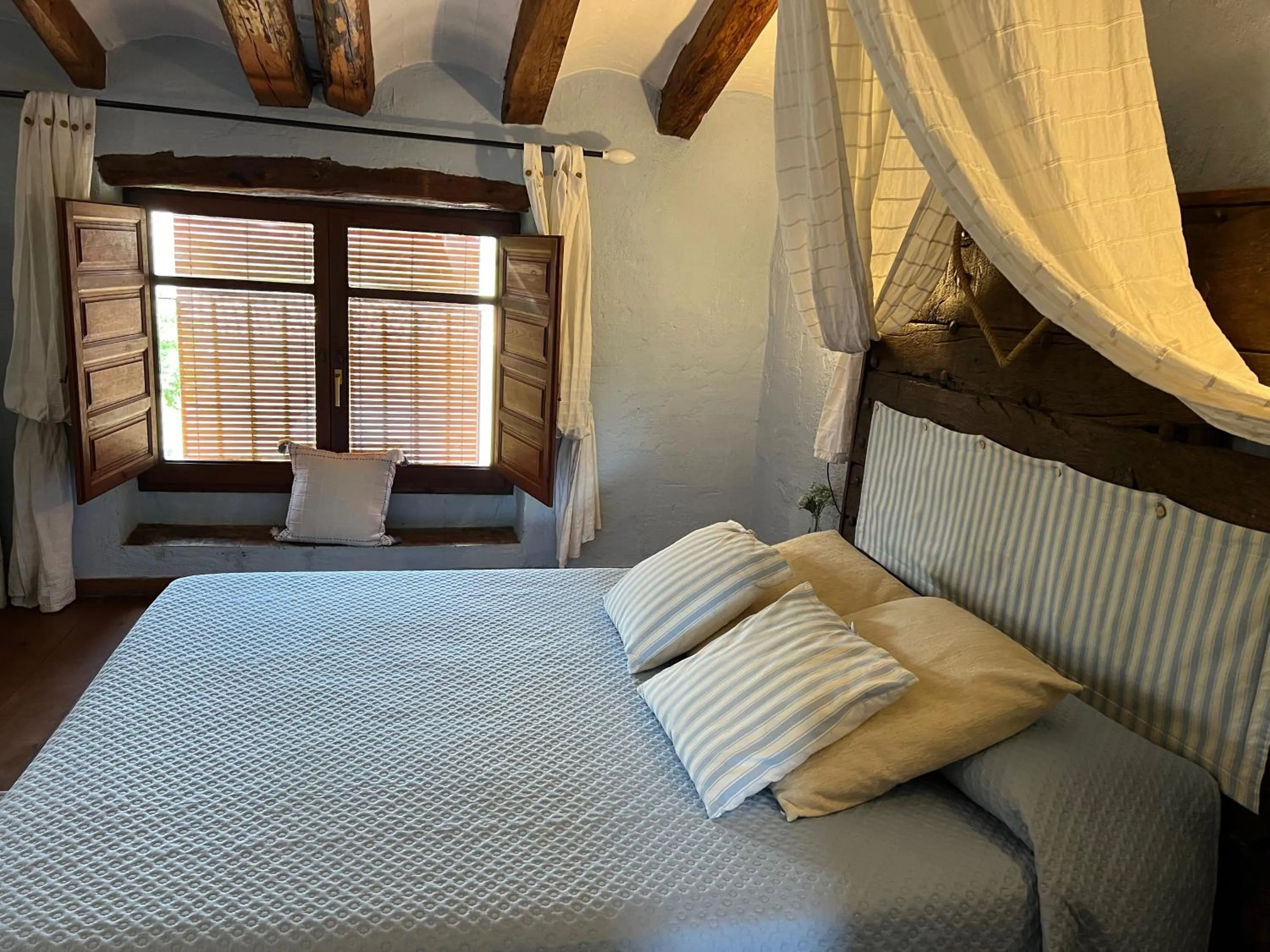 Bed in Les Vinyes Alojamiento Rural Boutique & SPA