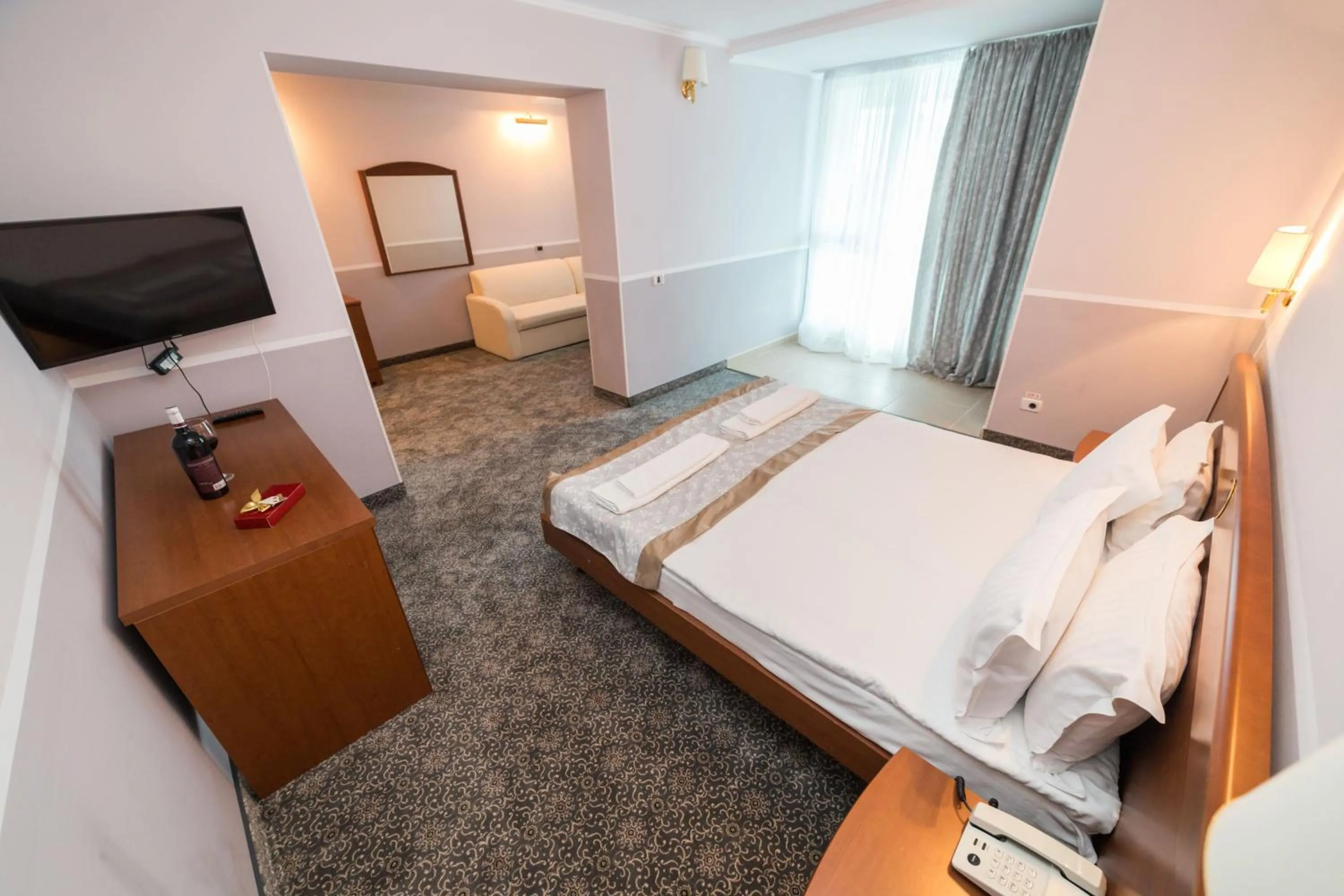 Living room, Bed in Bavaria Blu Hotel and Conference Centre