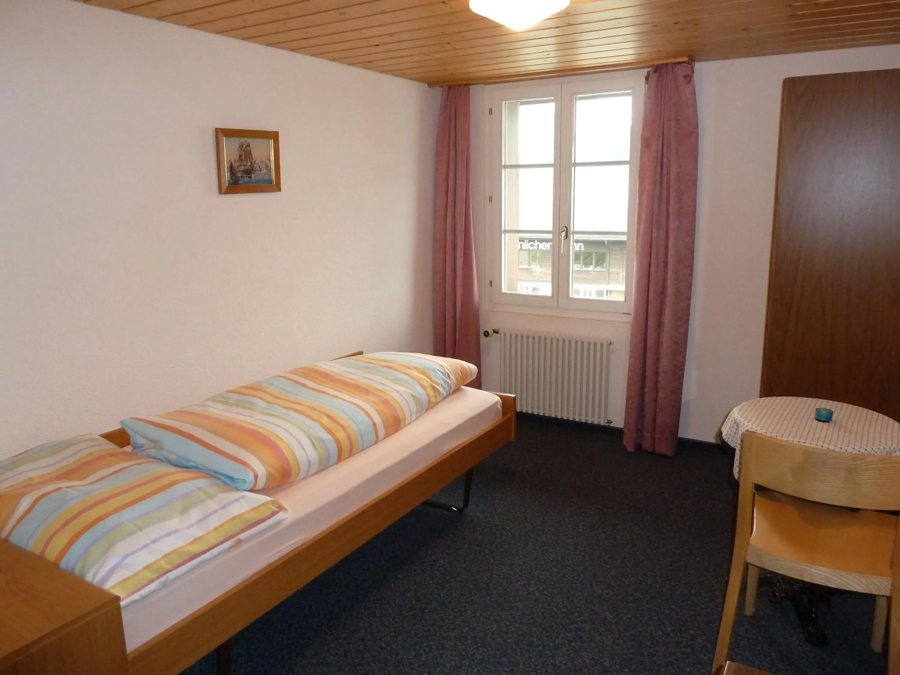 Photo of the whole room, Bed in Berghaus Männlichen