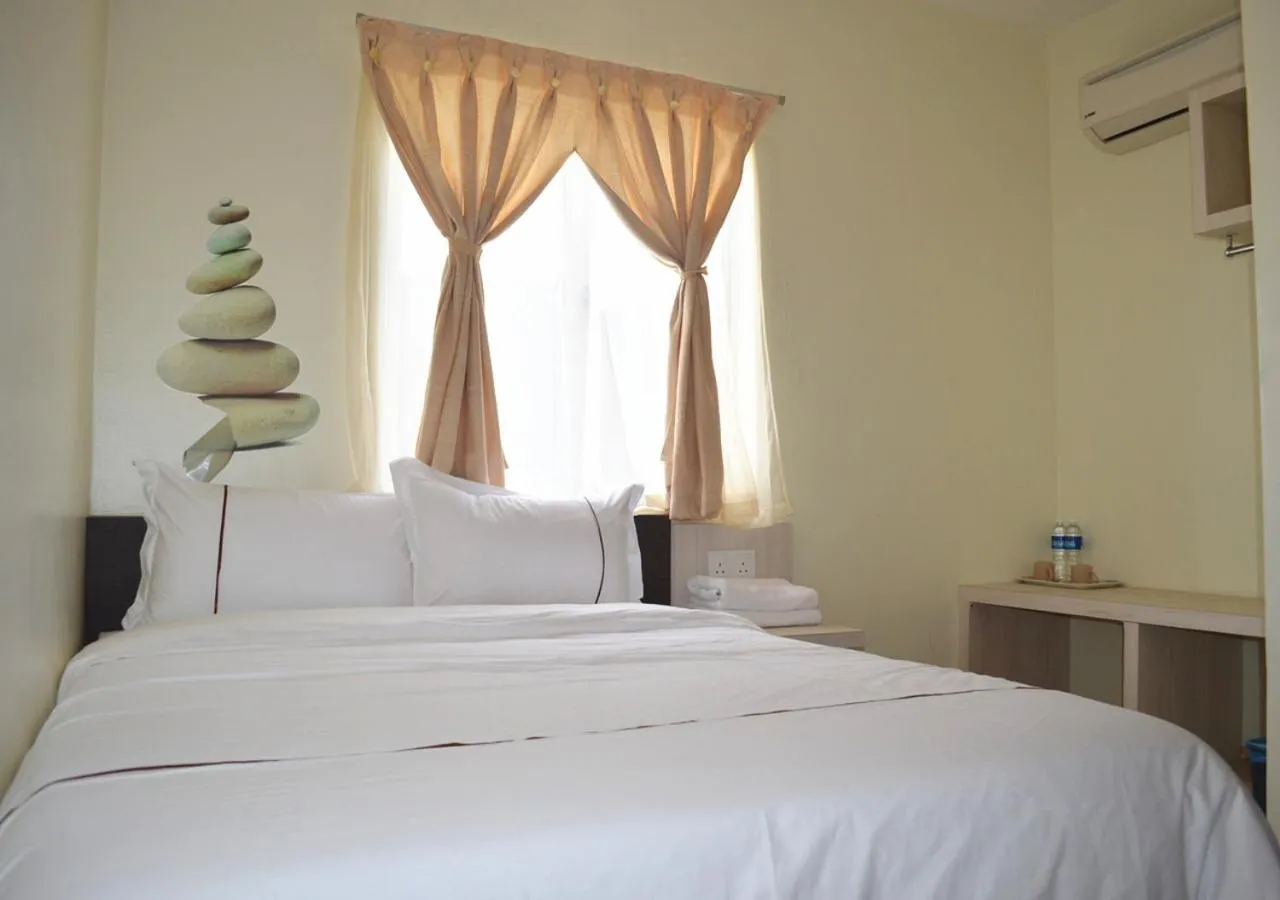 Bed in Angsoka Hotel