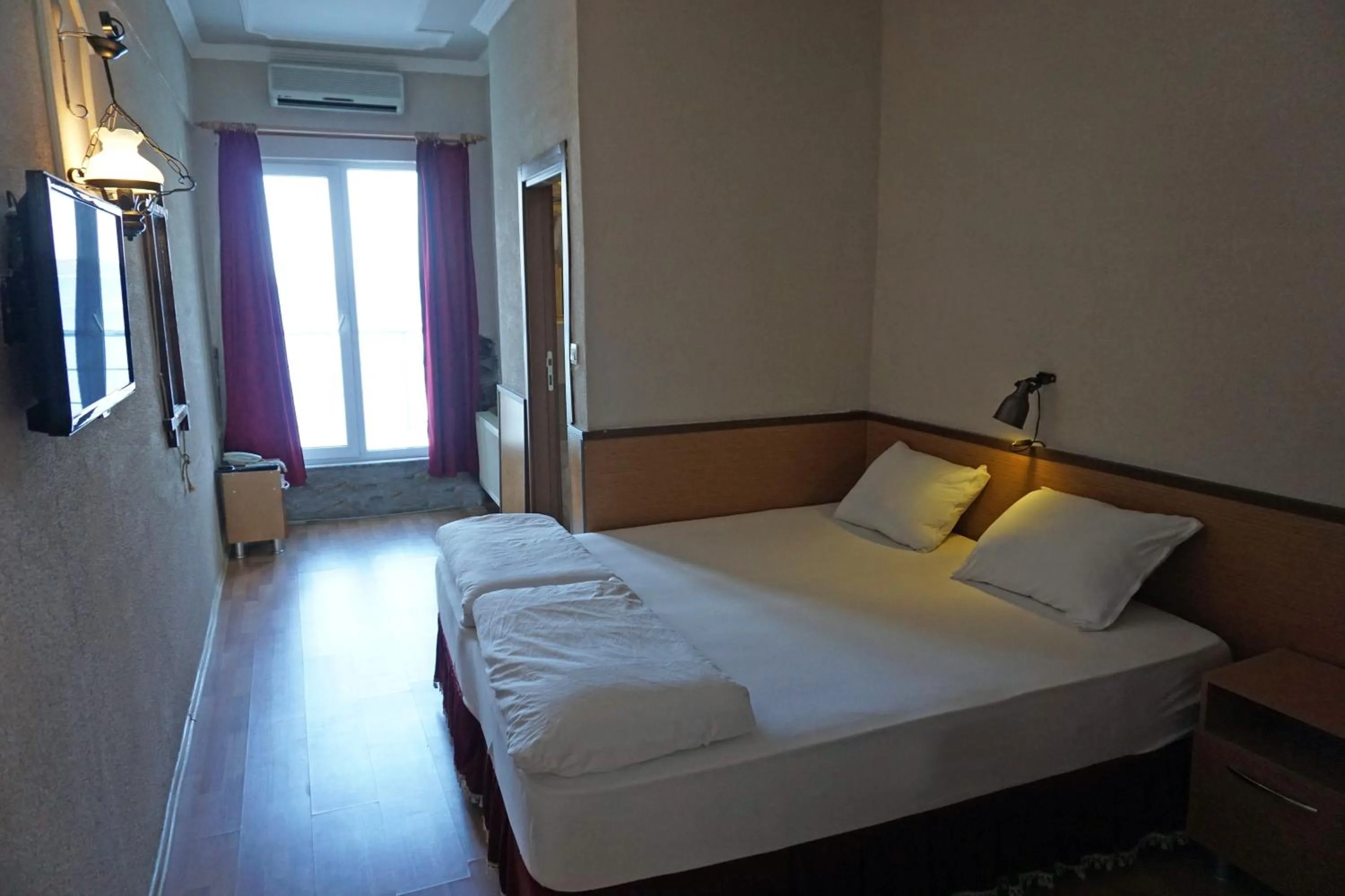 Bedroom in Aqua Boss Hotel