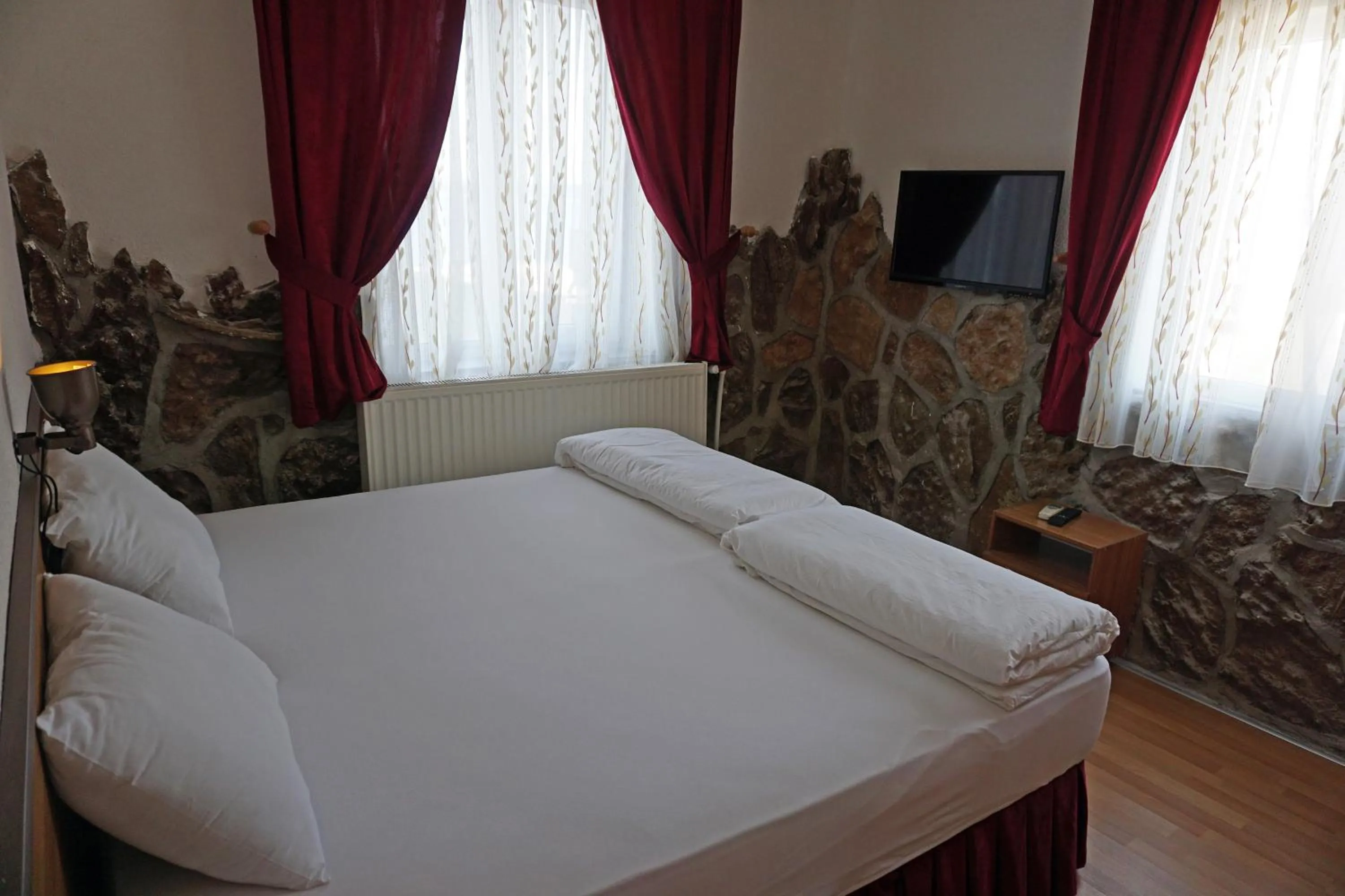 Bedroom in Aqua Boss Hotel