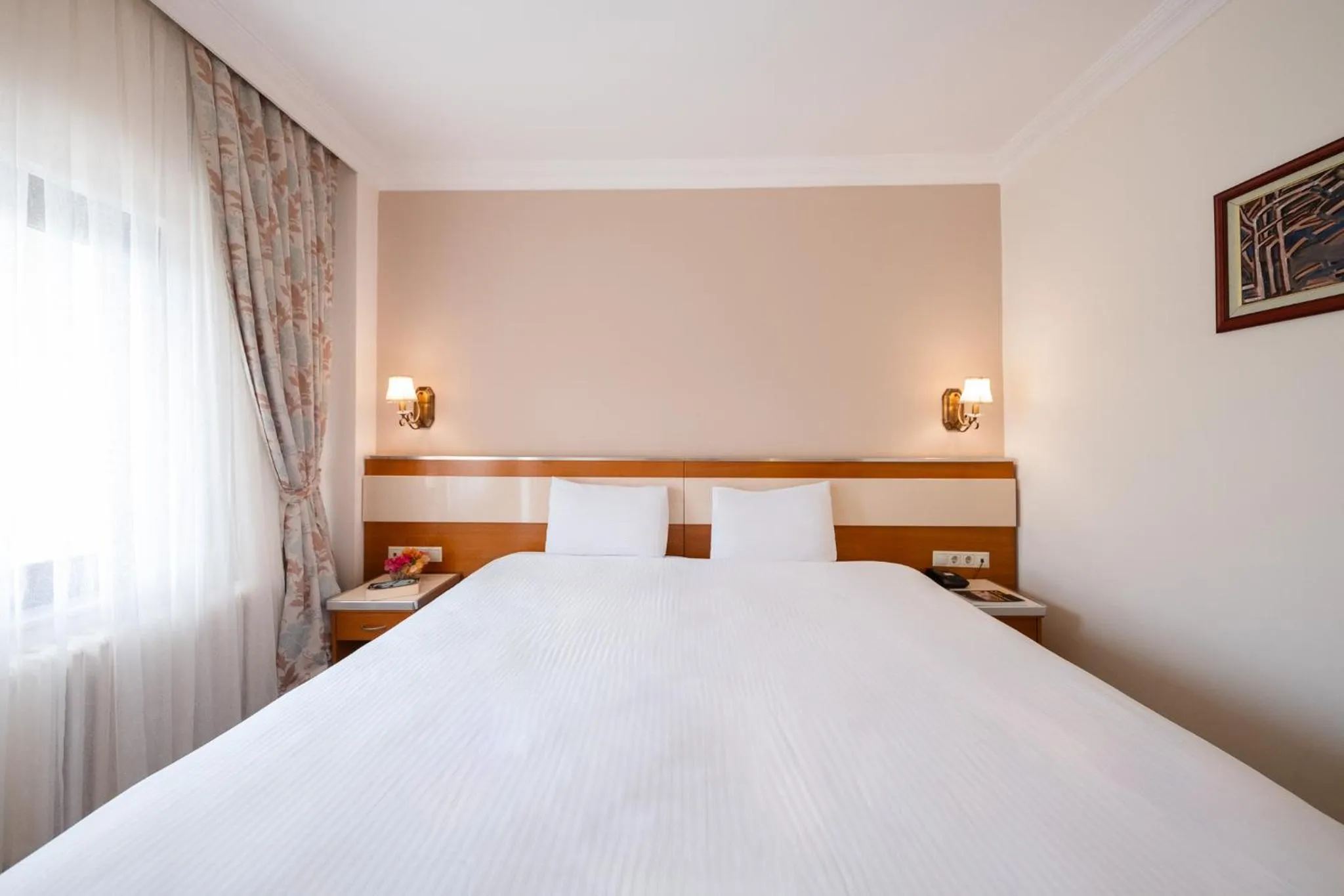 Bed in Iris Hotel & Spa