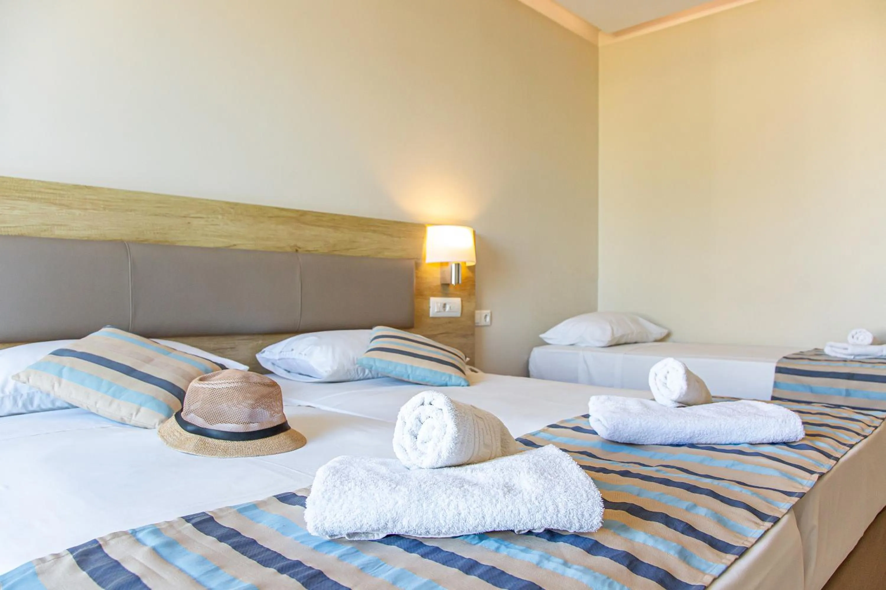 Bed in Theo Star Beach Hotel