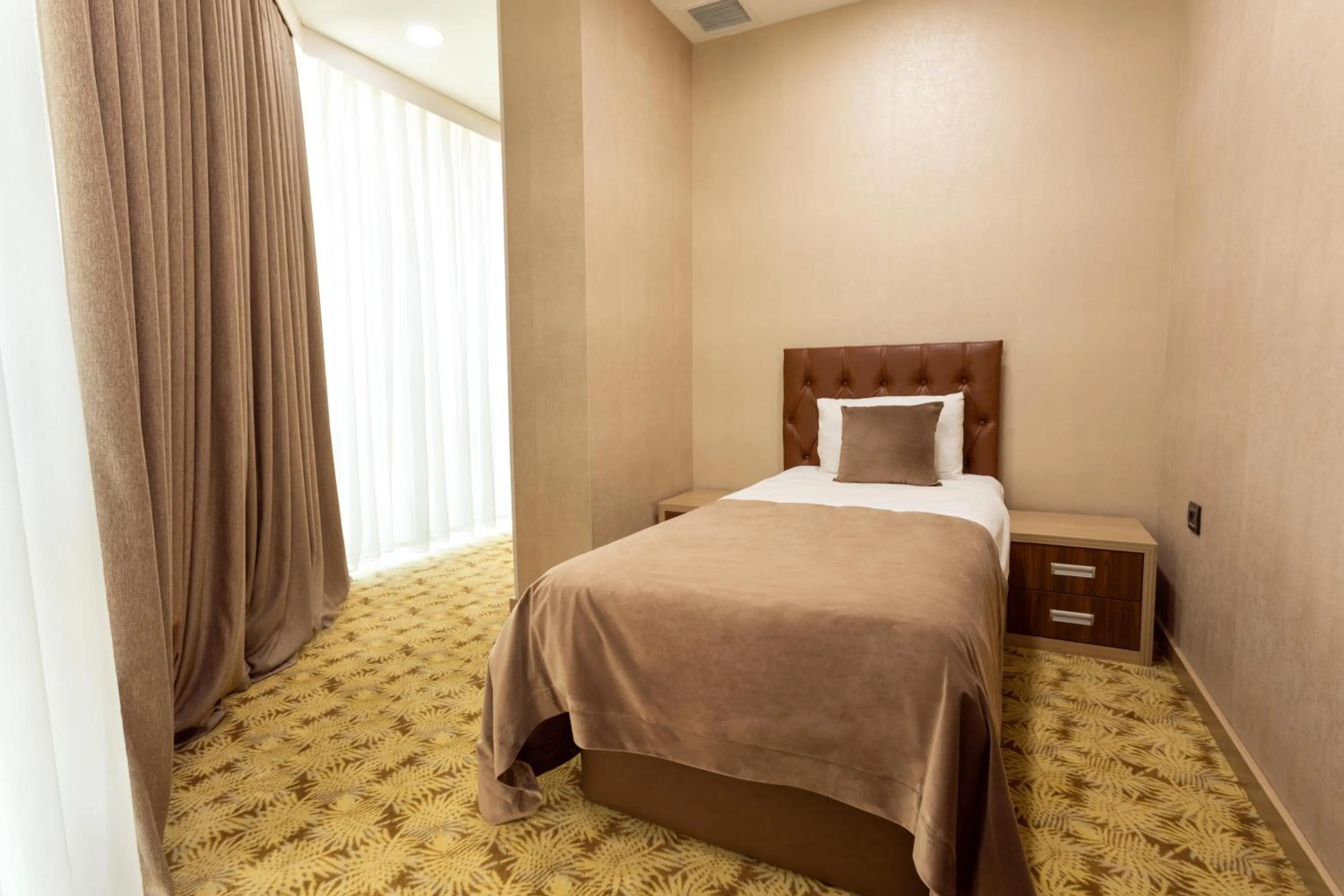 Bed in West Shine Hotel