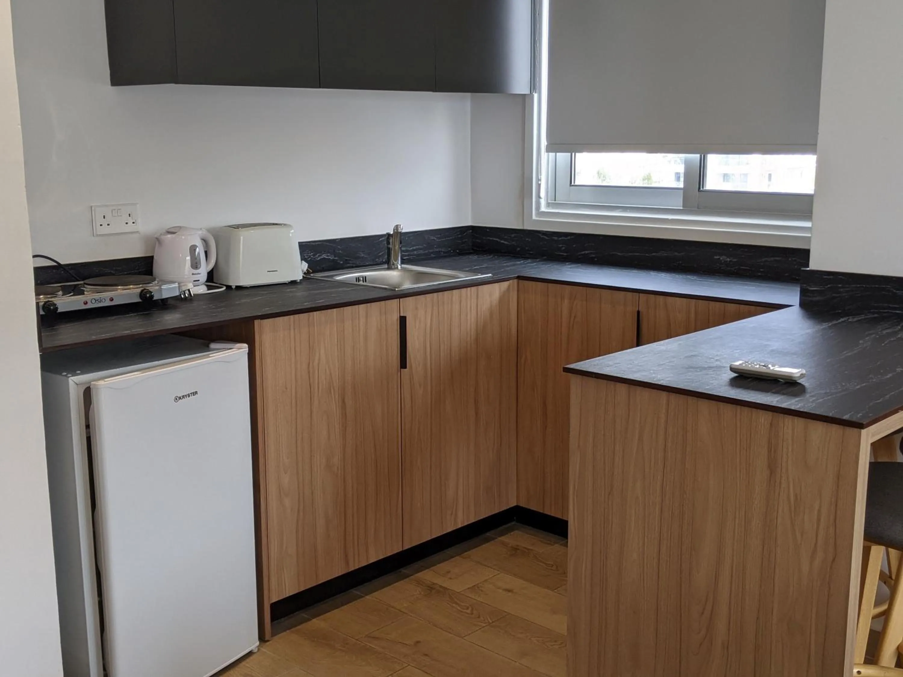 Kitchen or kitchenette in Sunflower Hotel Apartments