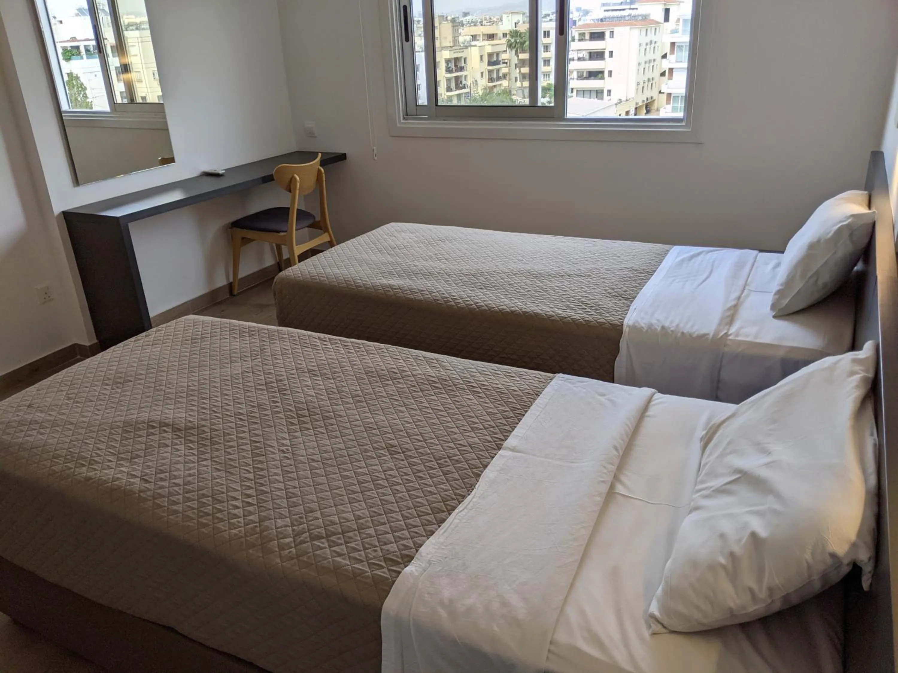 Bed in Sunflower Hotel Apartments
