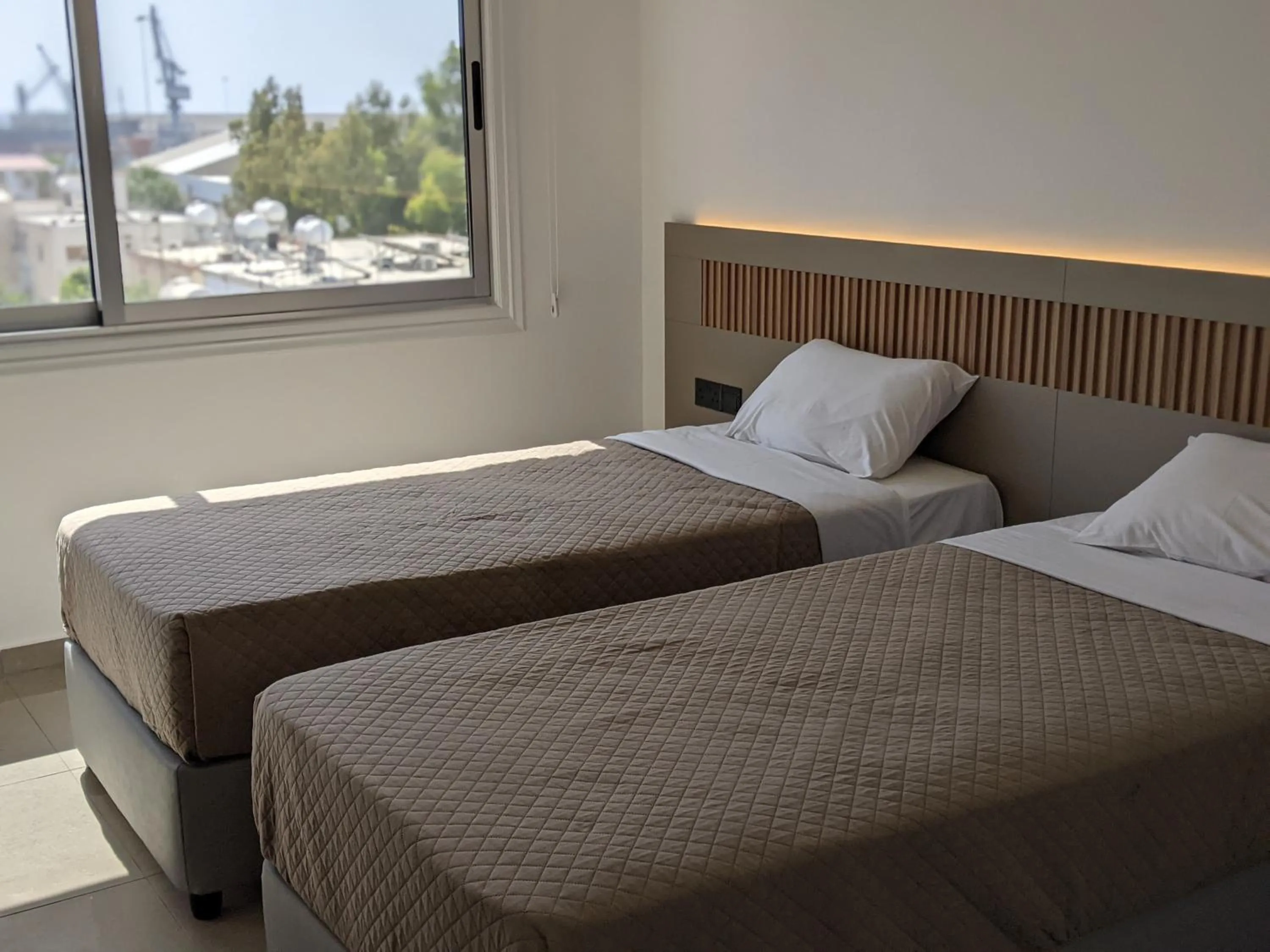 Bed in Sunflower Hotel Apartments