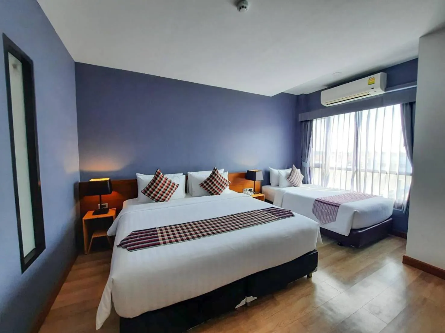 Photo of the whole room, Bed in Comet Hotel Surat Thani