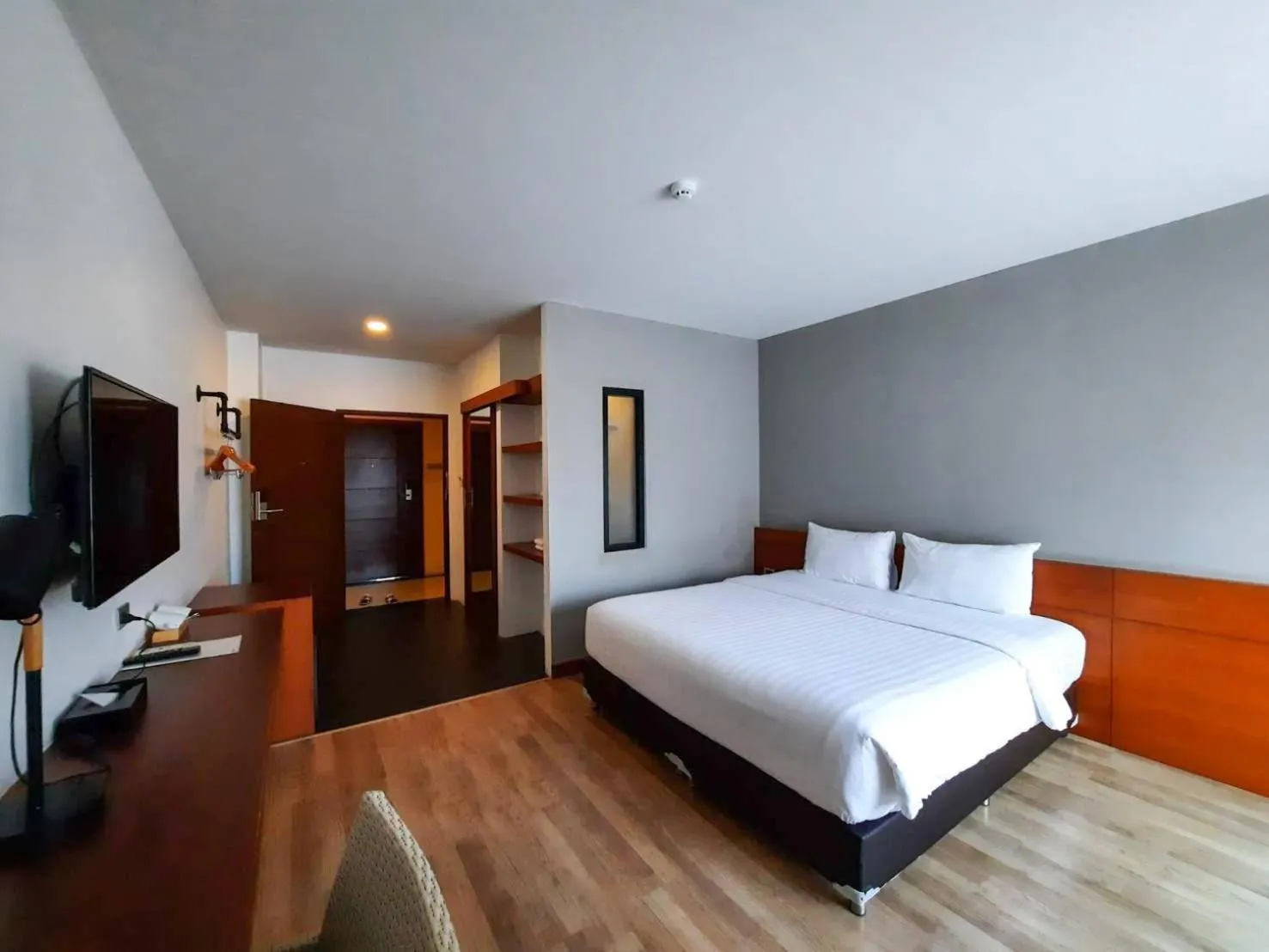Photo of the whole room, Bed in Comet Hotel Surat Thani