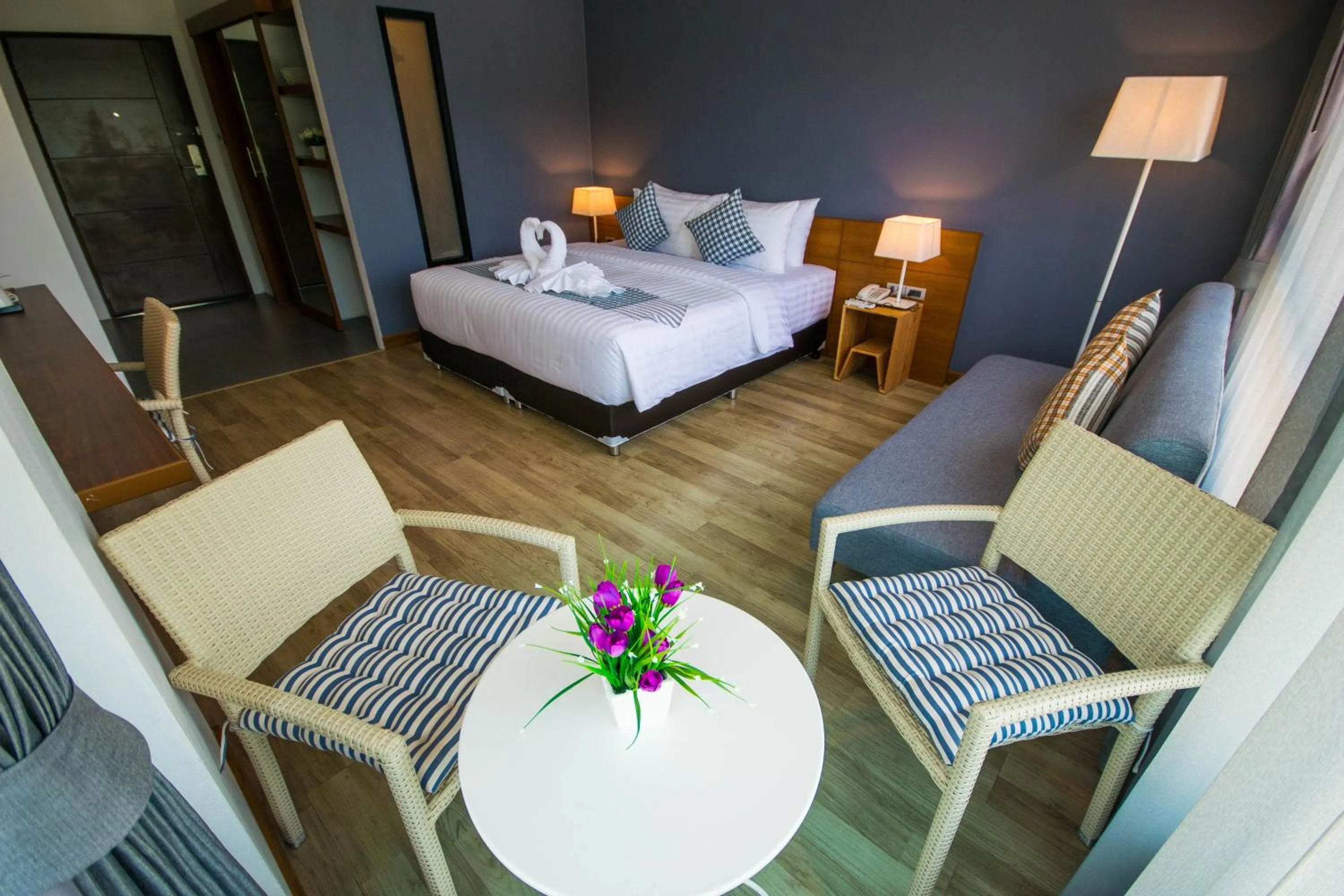 Photo of the whole room, Bed in Comet Hotel Surat Thani