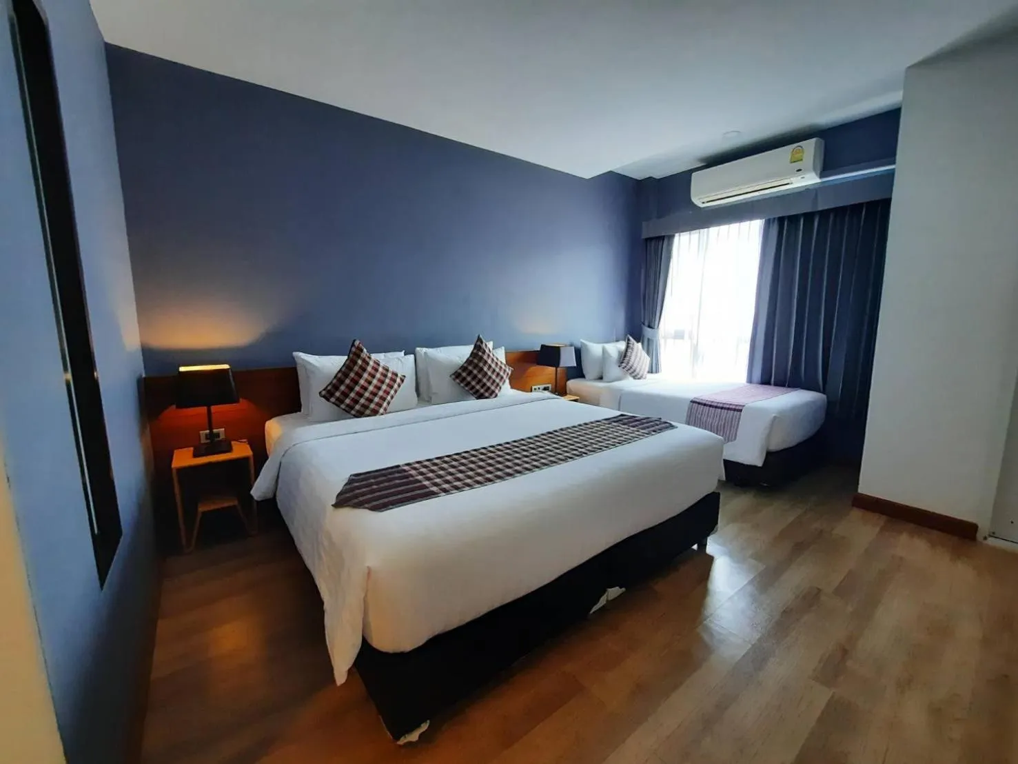Photo of the whole room, Bed in Comet Hotel Surat Thani
