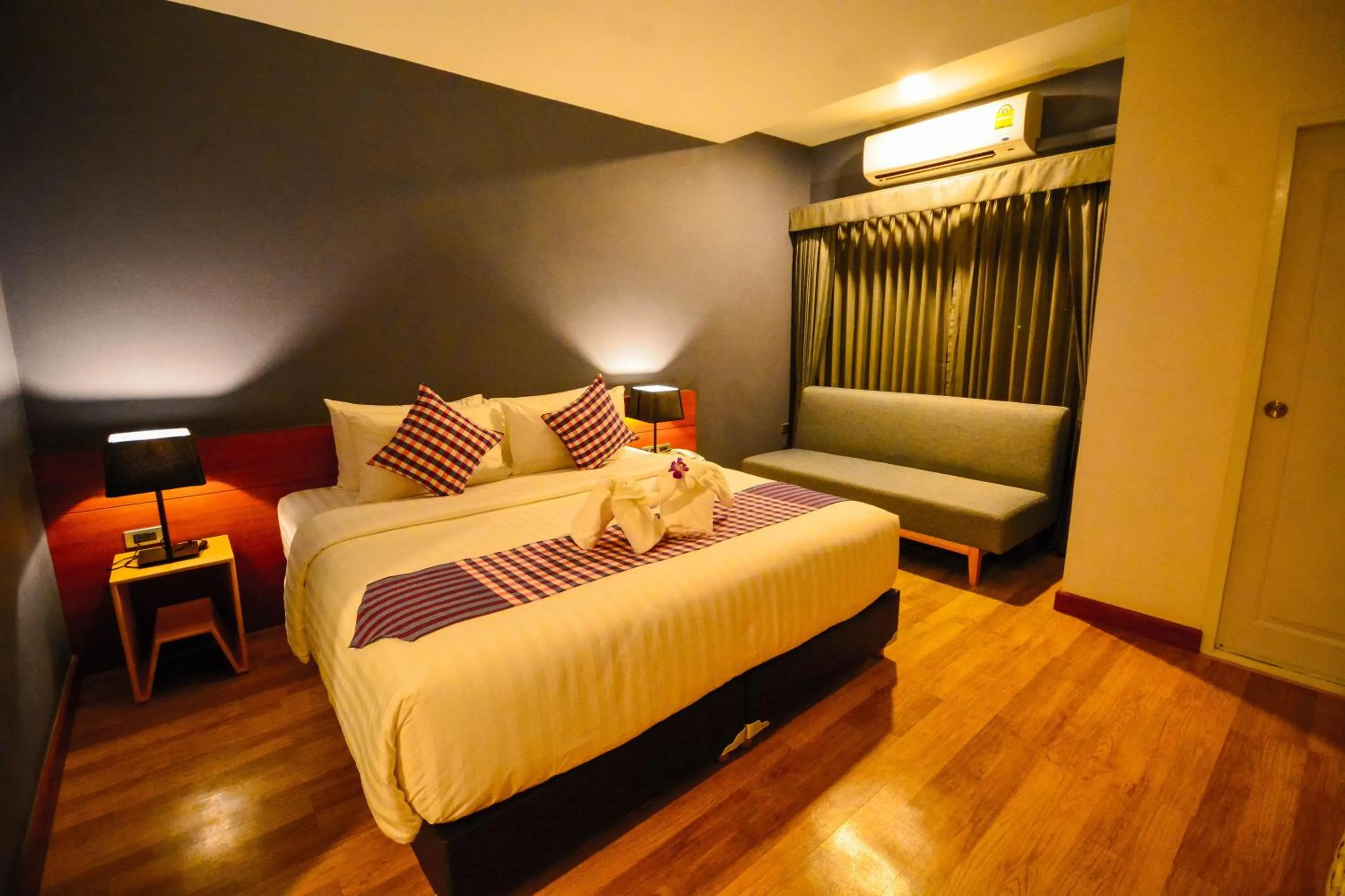 Photo of the whole room, Bed in Comet Hotel Surat Thani