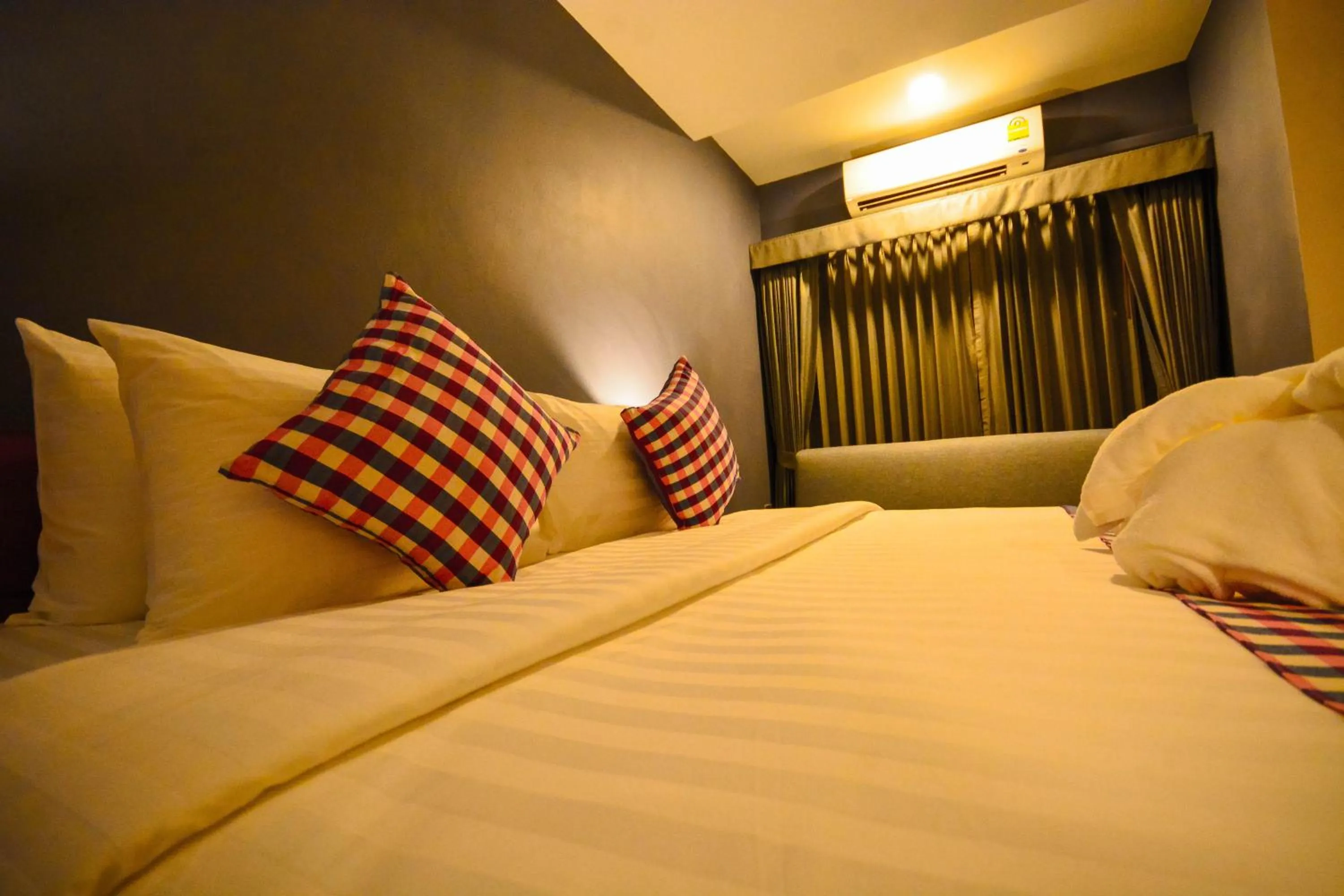 Photo of the whole room, Bed in Comet Hotel Surat Thani