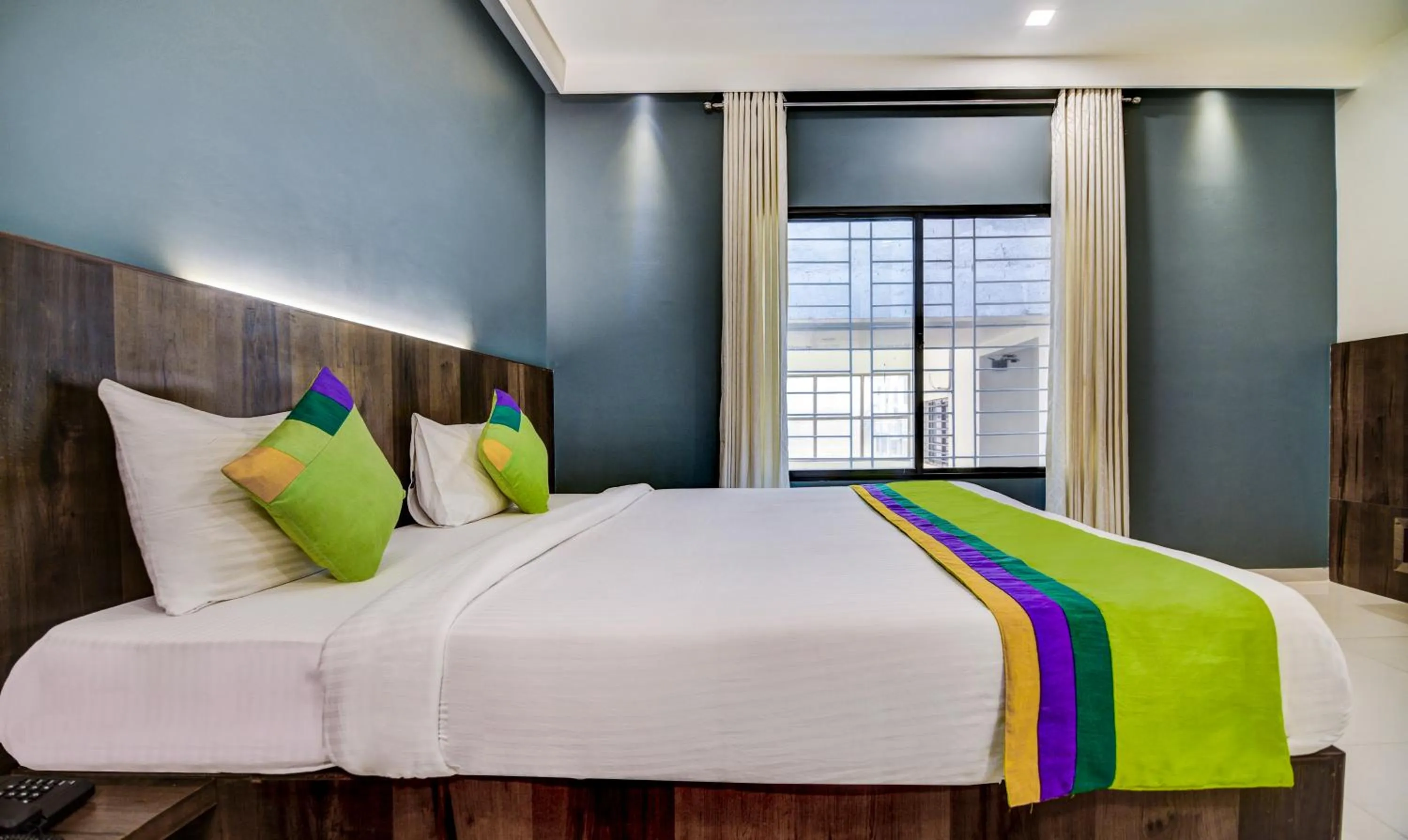 Bedroom, Bed in Treebo Shree Sai Suites - 2km from Mahalaxmi Temple