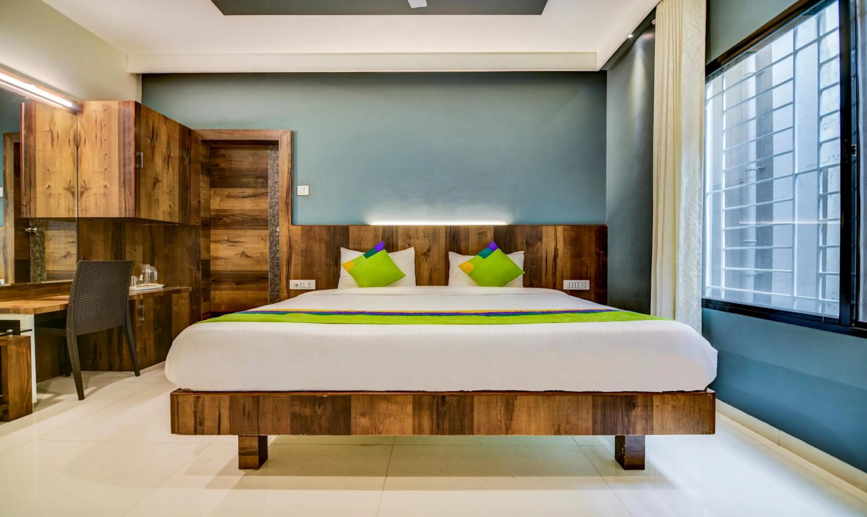 Bedroom, Bed in Treebo Shree Sai Suites - 2km from Mahalaxmi Temple