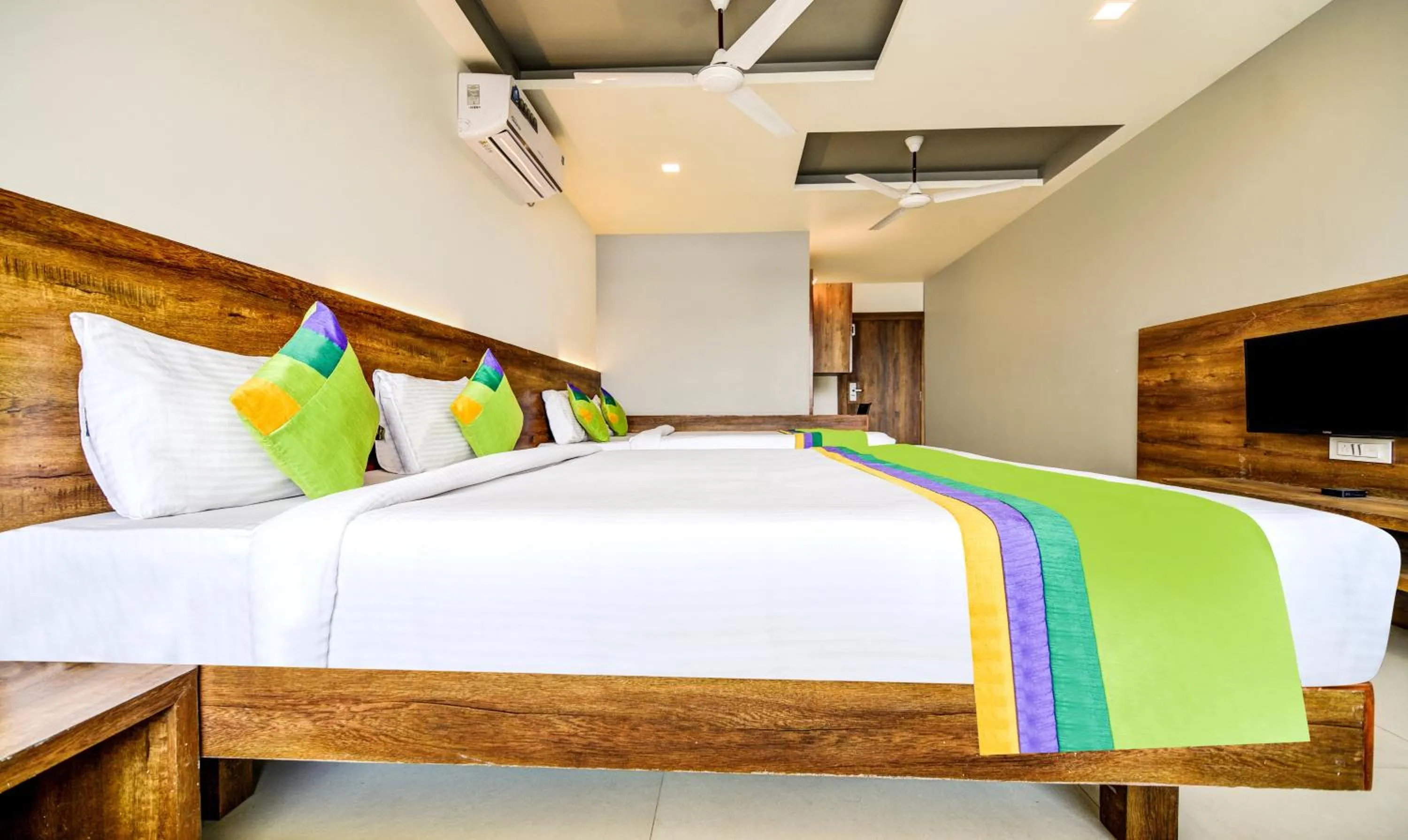 Bedroom, Bed in Treebo Shree Sai Suites - 2km from Mahalaxmi Temple