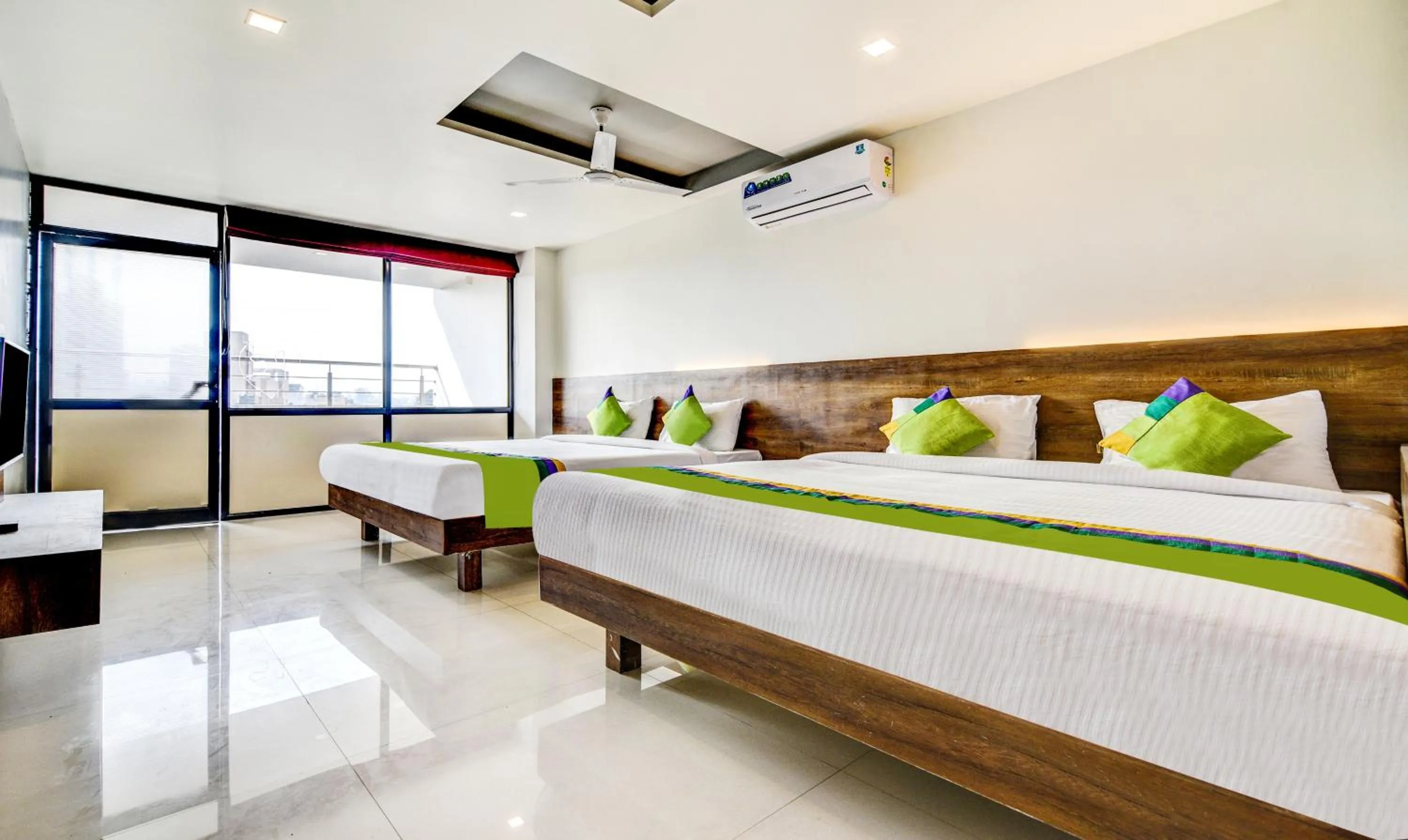 Bedroom, Bed in Treebo Shree Sai Suites - 2km from Mahalaxmi Temple
