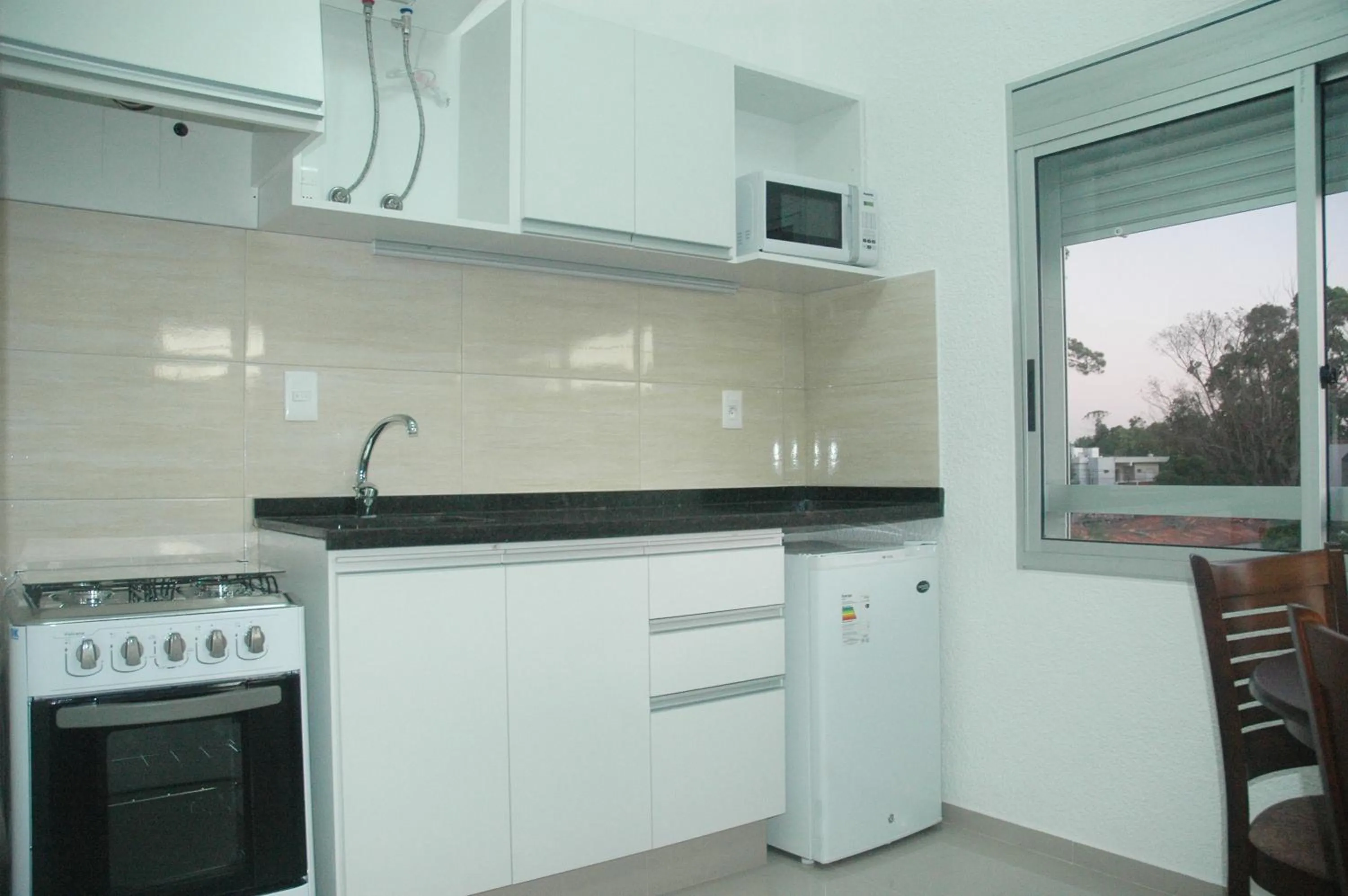 Kitchen or kitchenette in Paradise Complejo Turístico