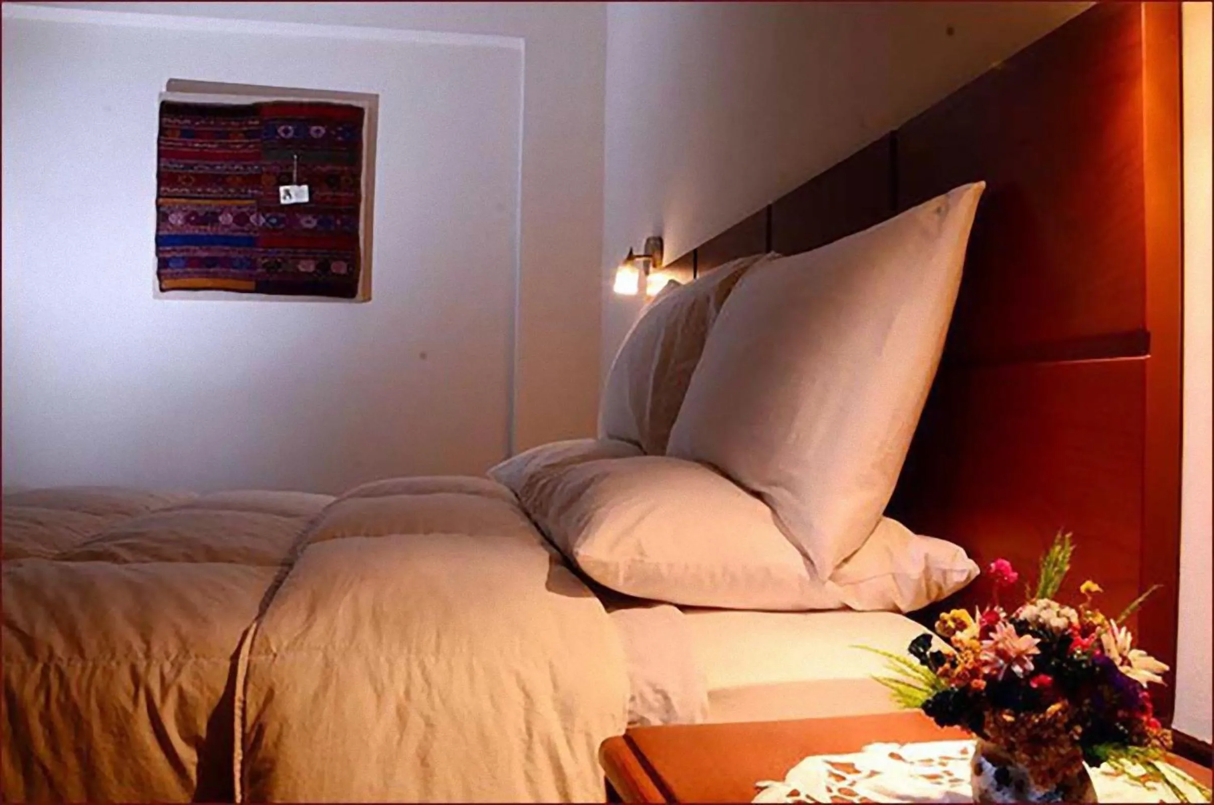 Bed in Golden Inca Hotel