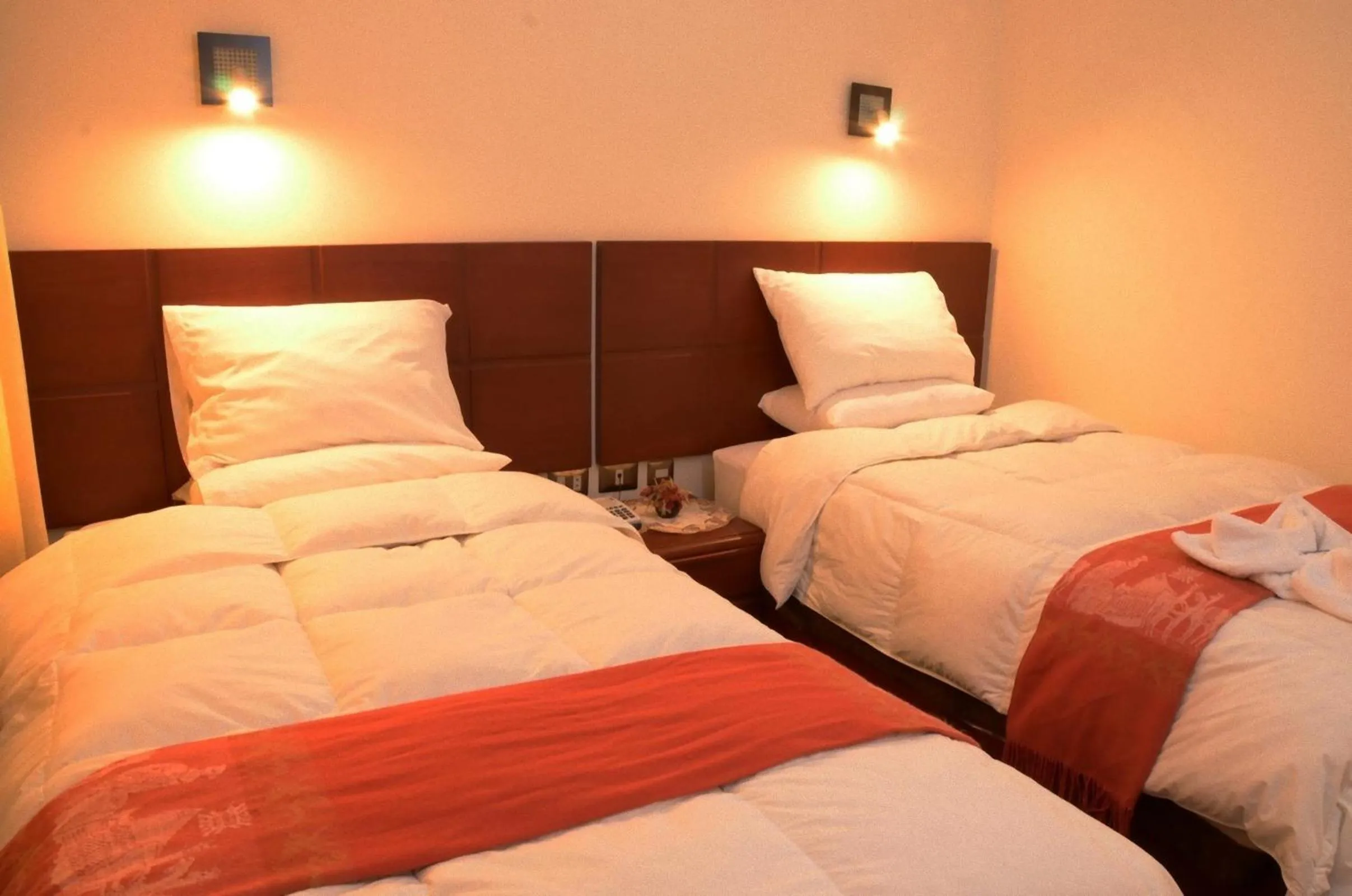 Bed in Golden Inca Hotel