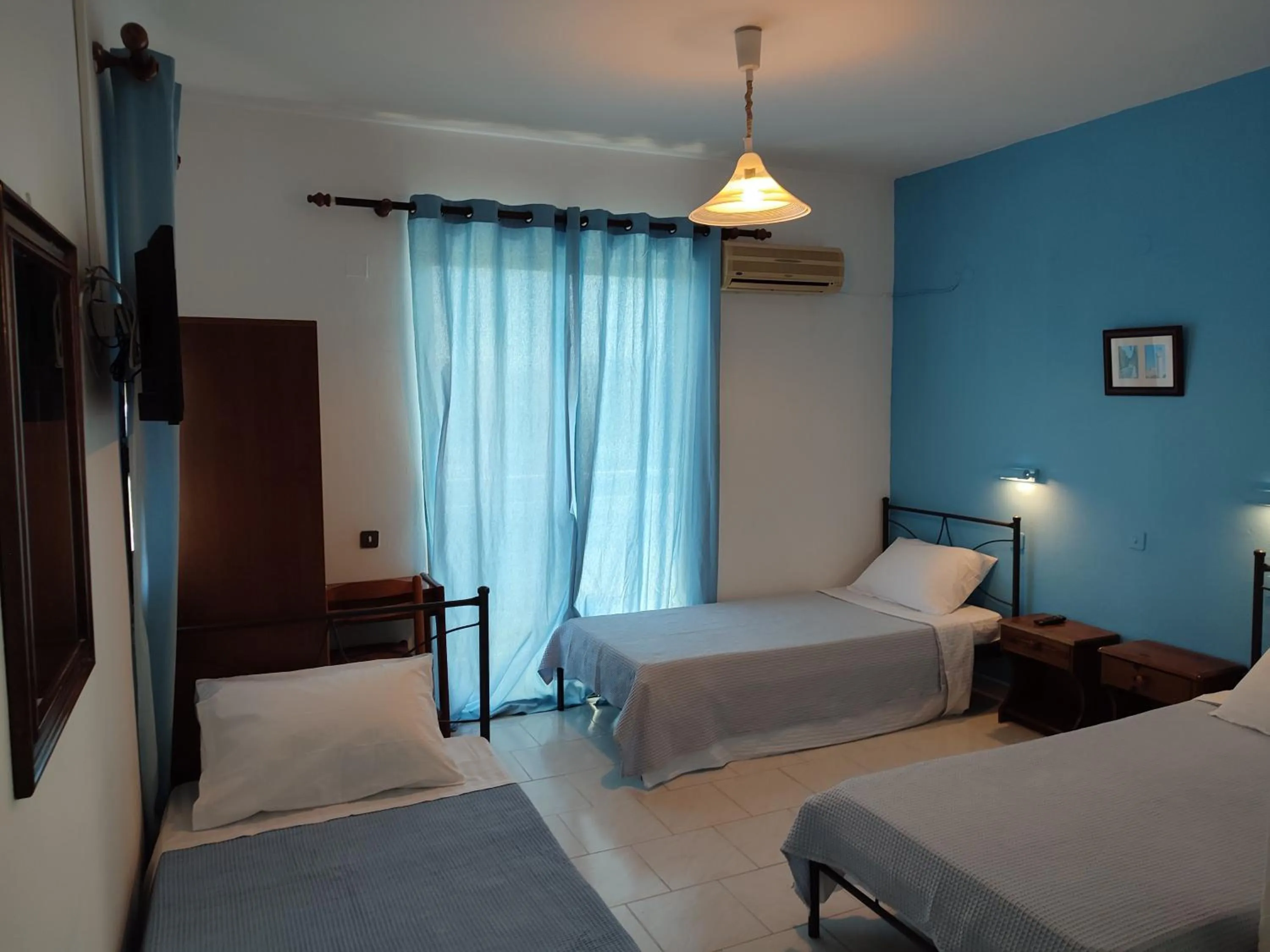 Bed in Dolphin Apartments