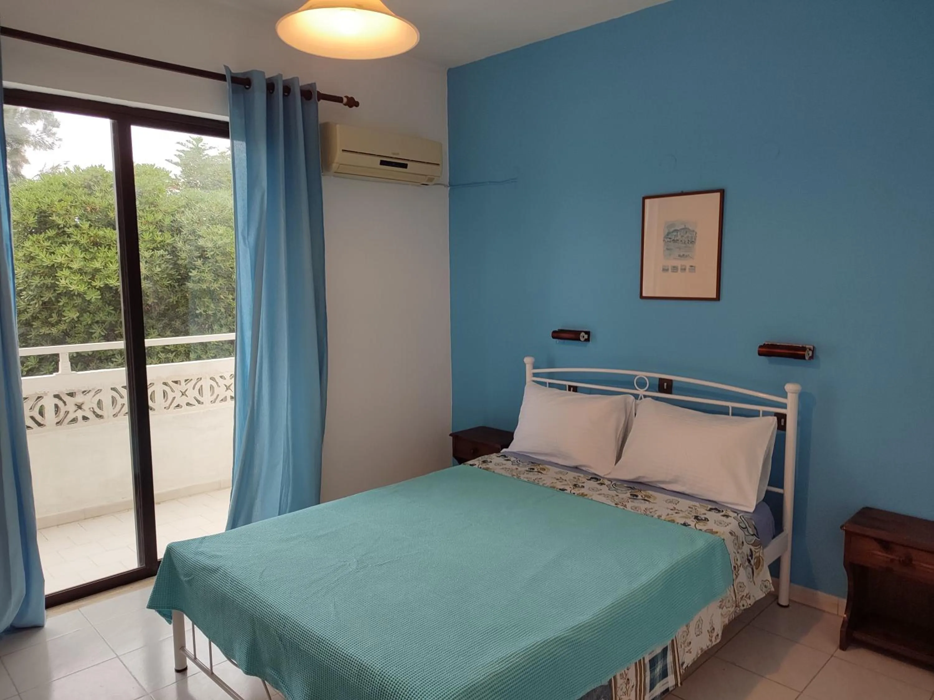 Bed in Dolphin Apartments