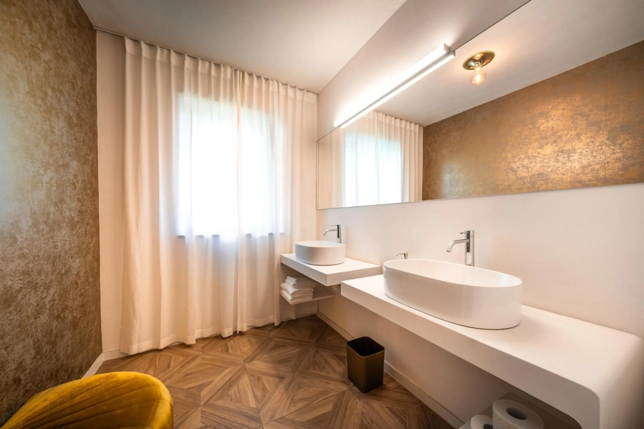 Bathroom in goldfinger + suites