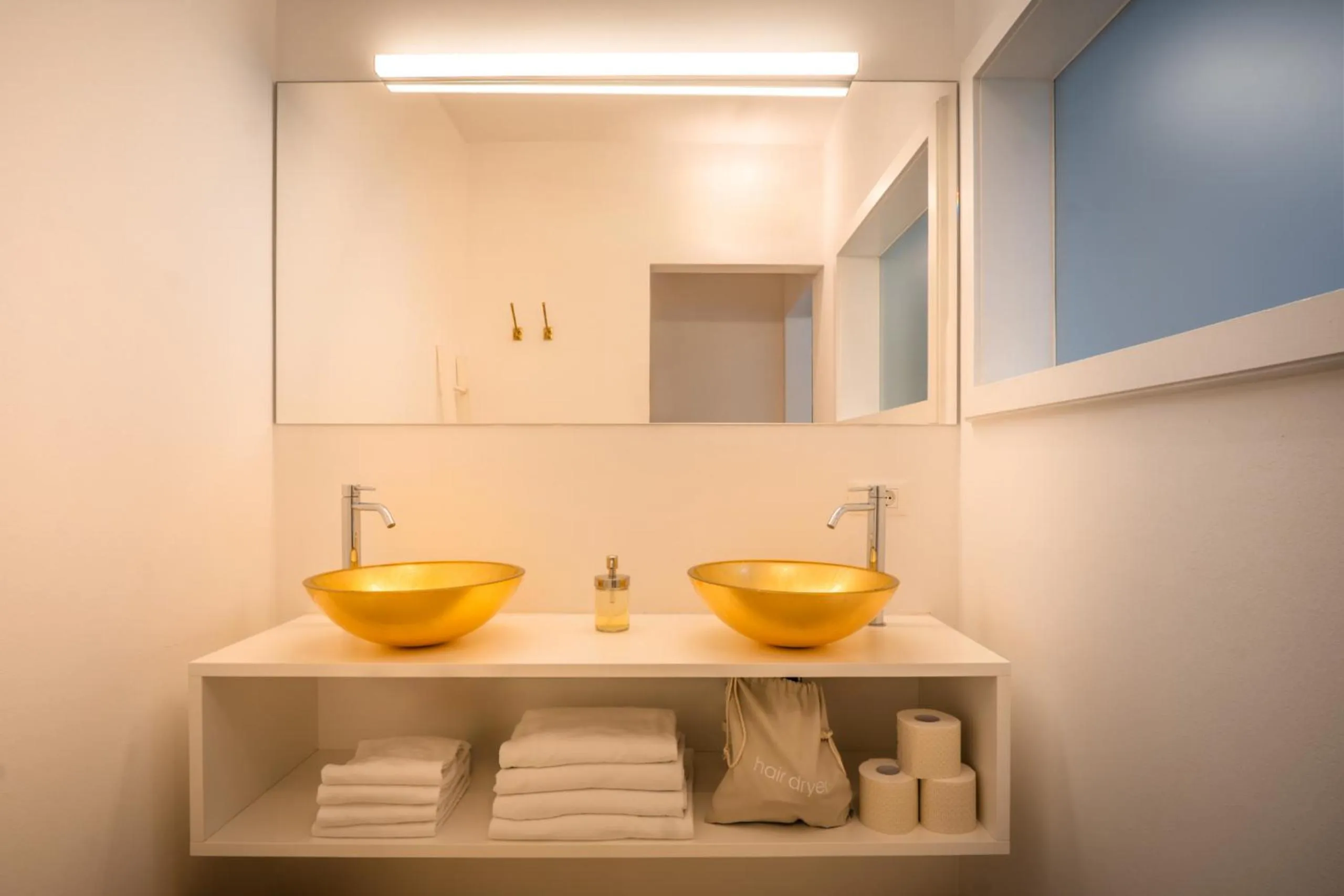 Bathroom in goldfinger + suites