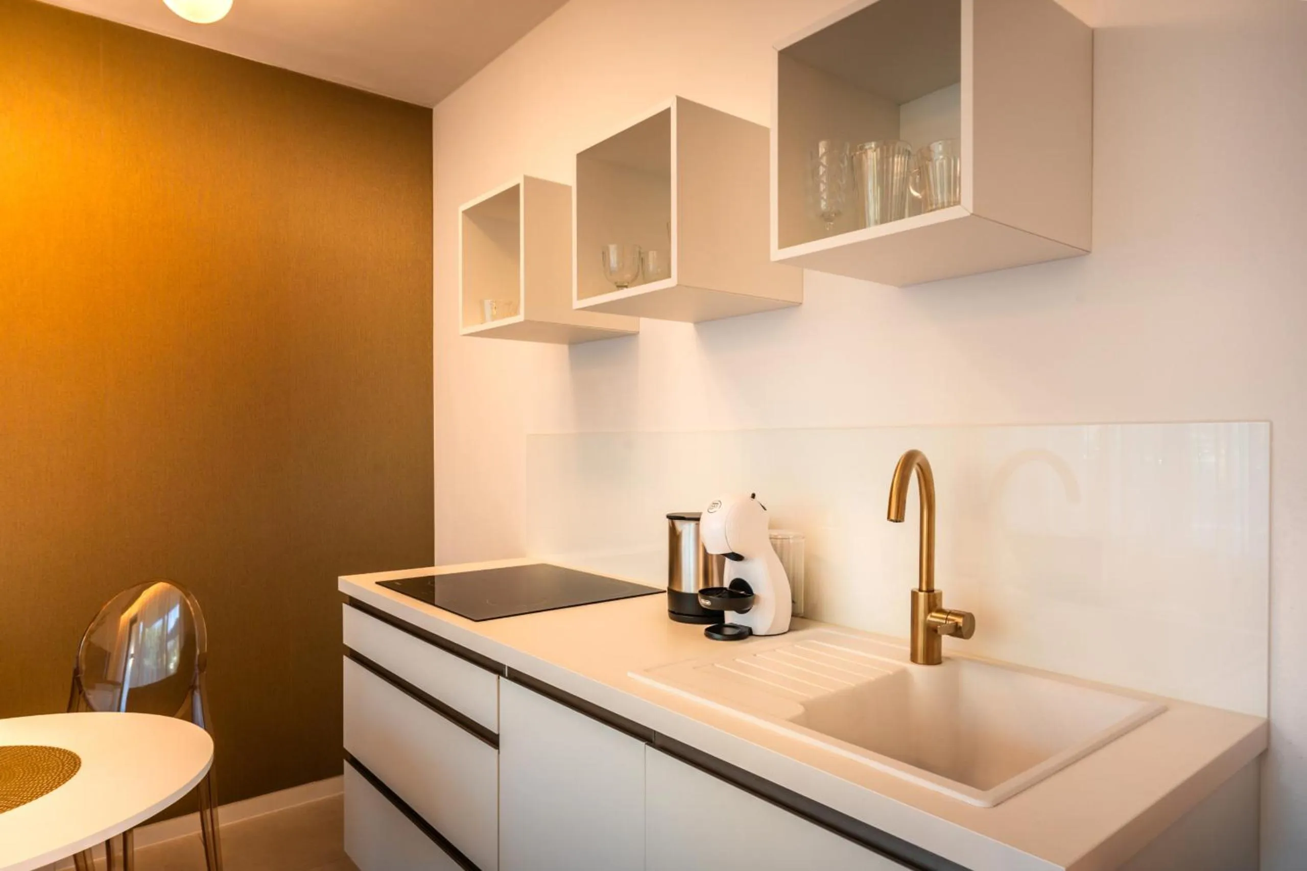 Kitchen or kitchenette in goldfinger + suites