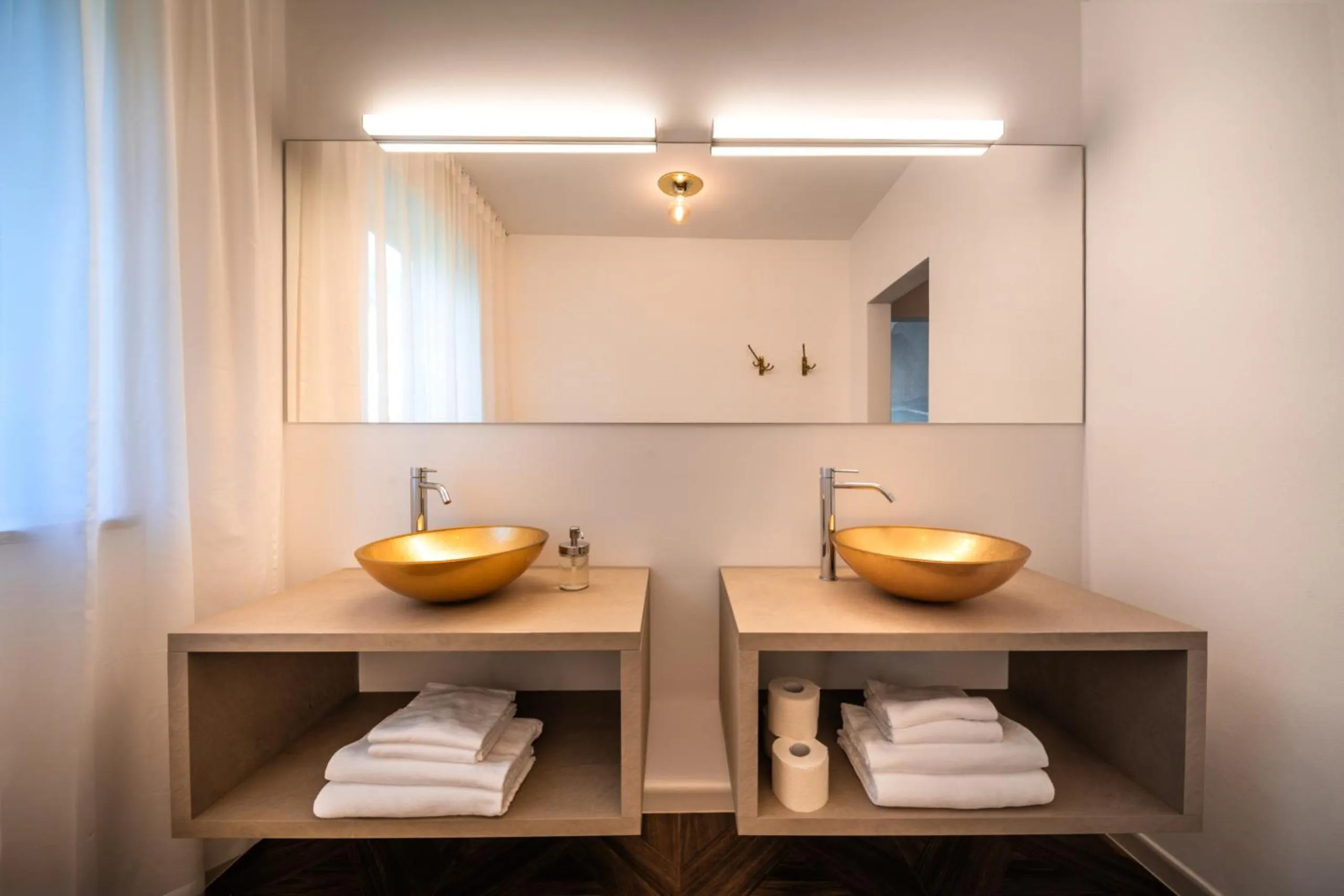 Bathroom in goldfinger + suites