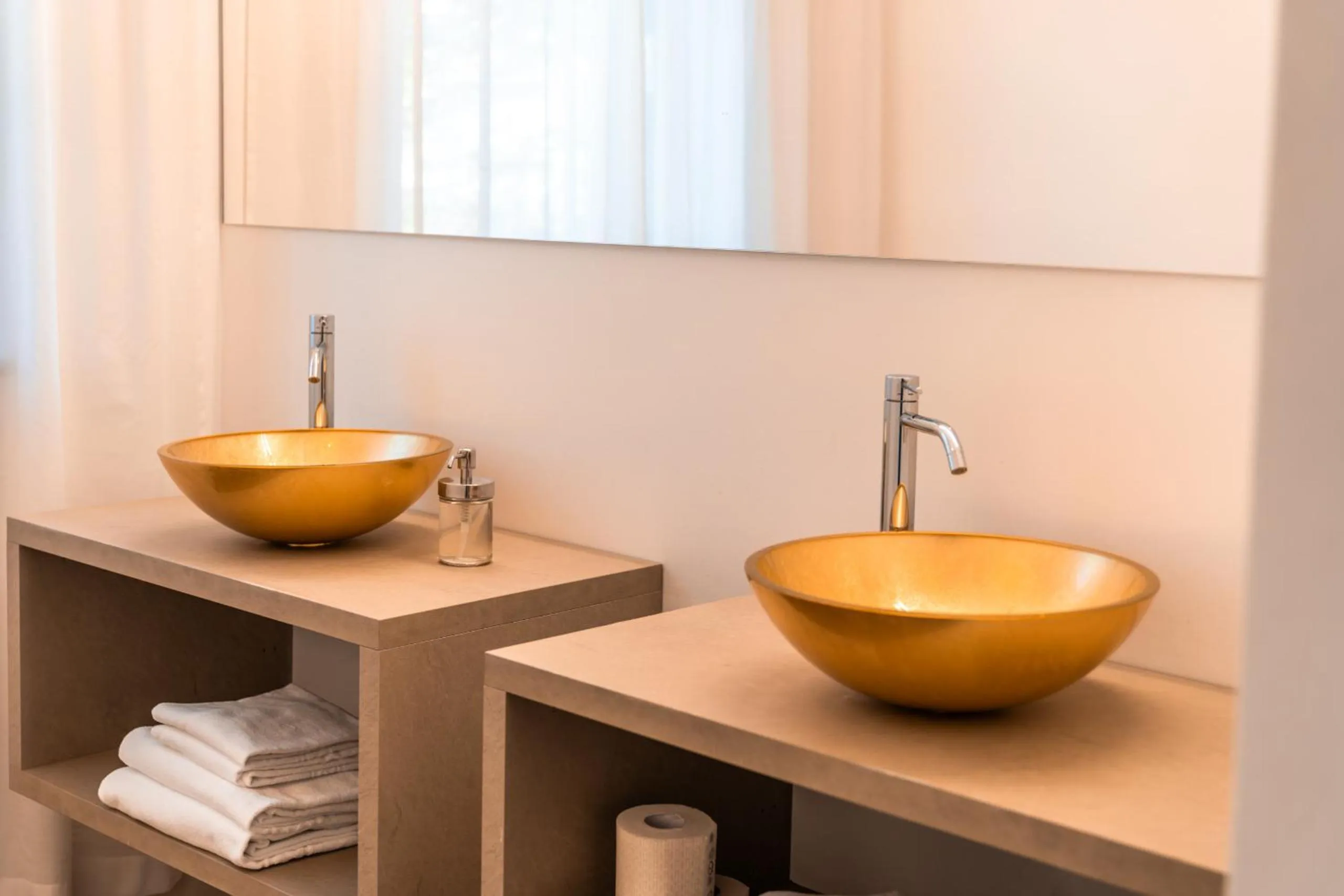 Bathroom in goldfinger + suites