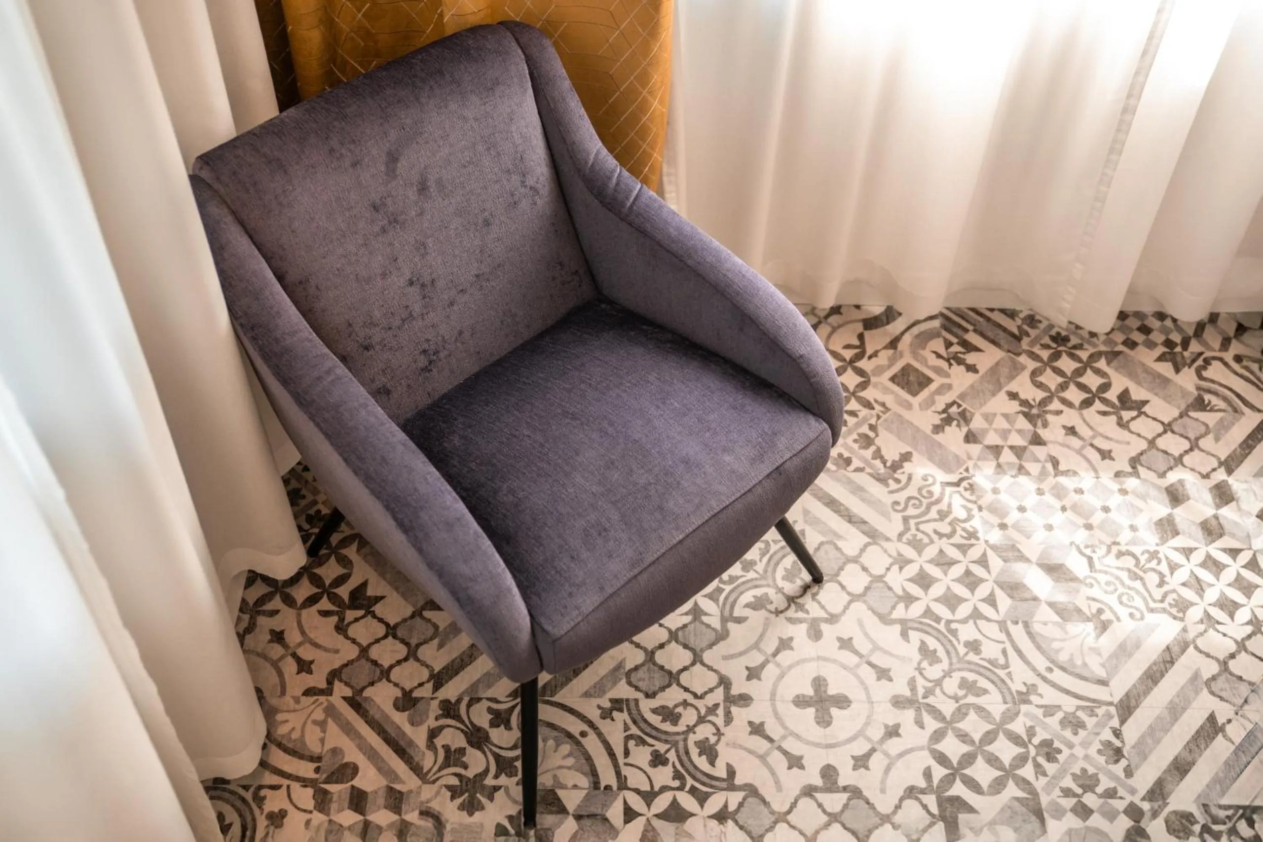 Seating area in goldfinger + suites