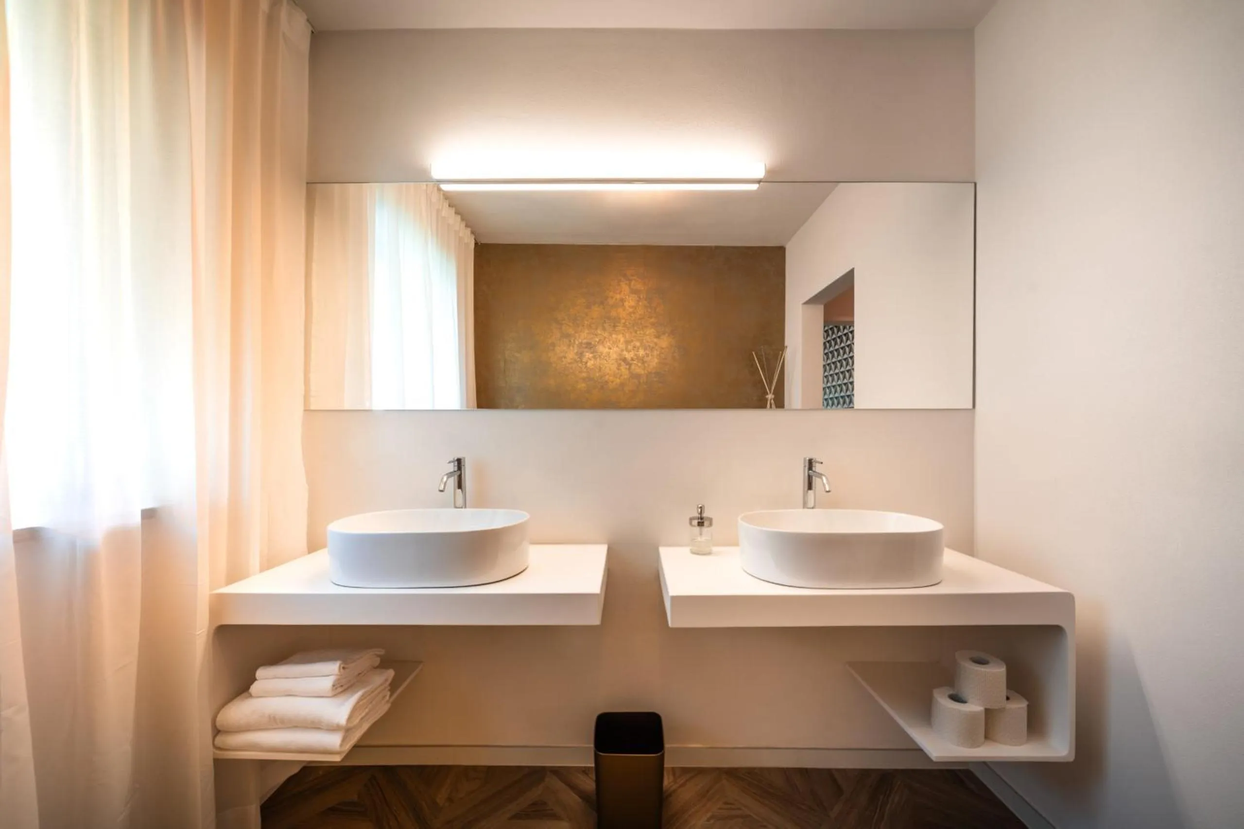 Bathroom in goldfinger + suites