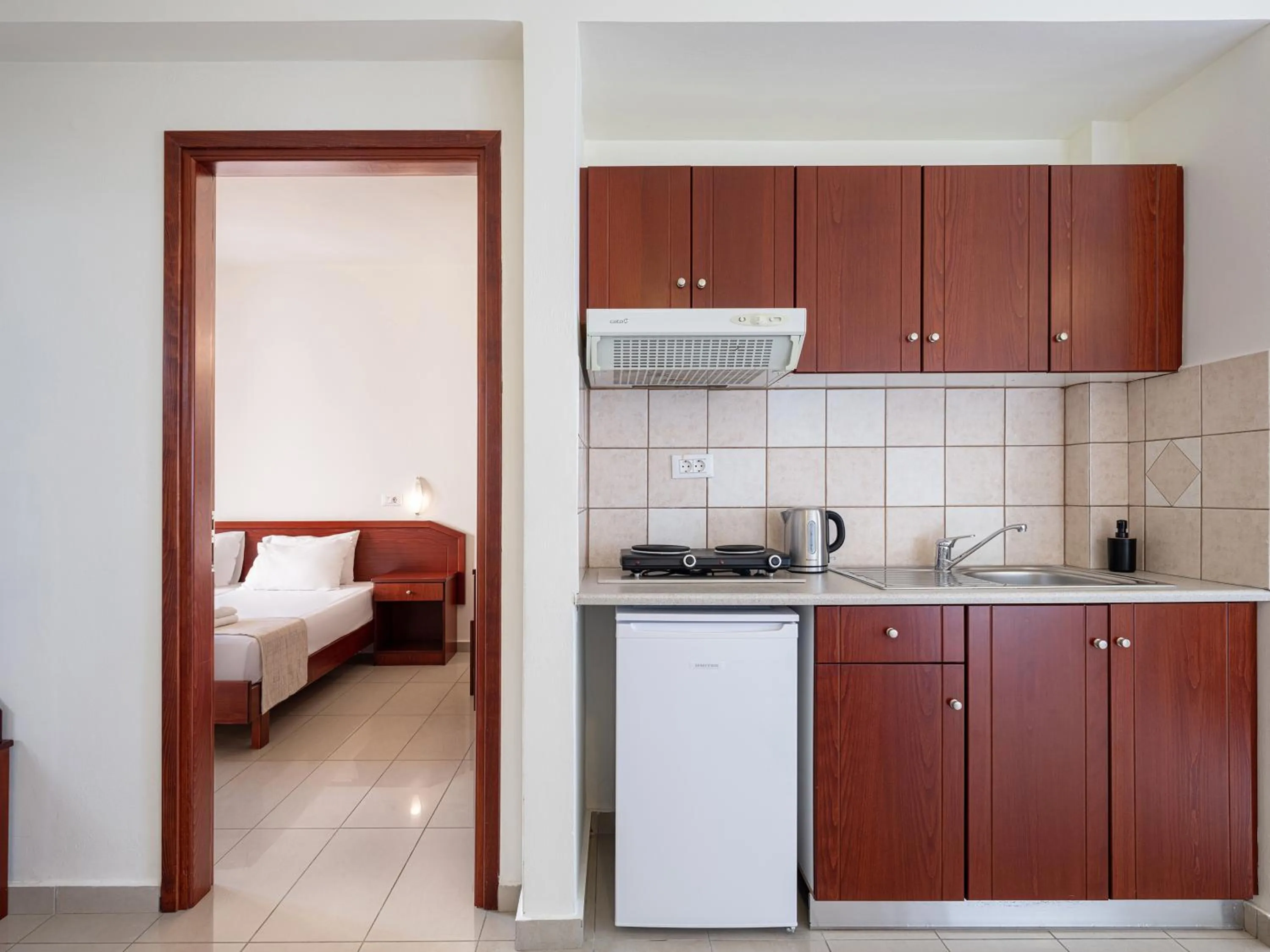 Kitchen or kitchenette, Bed in Artemis Apartments